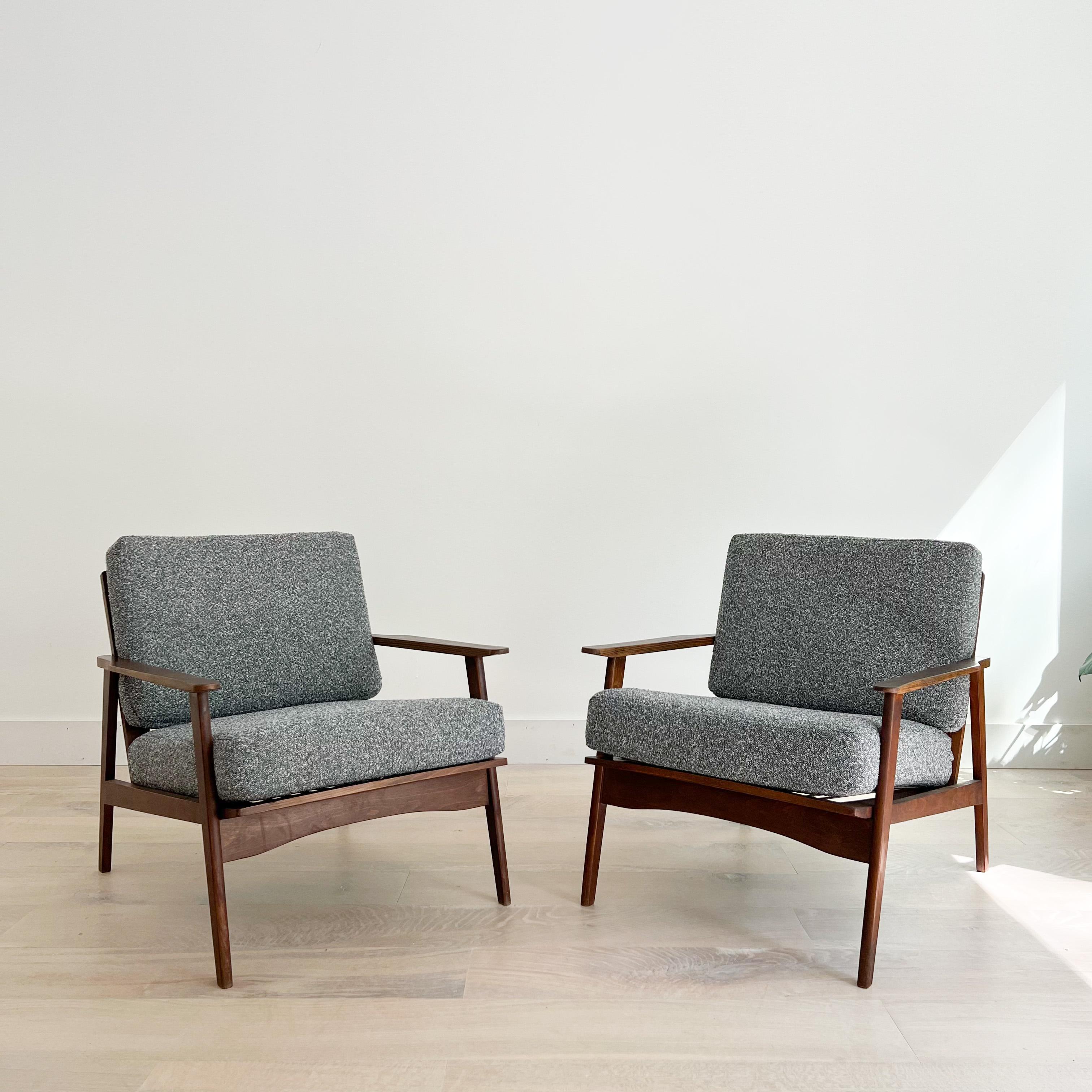 Pair of Mid-Century Modern lounge chairs. New foam and grey tweed upholstery.