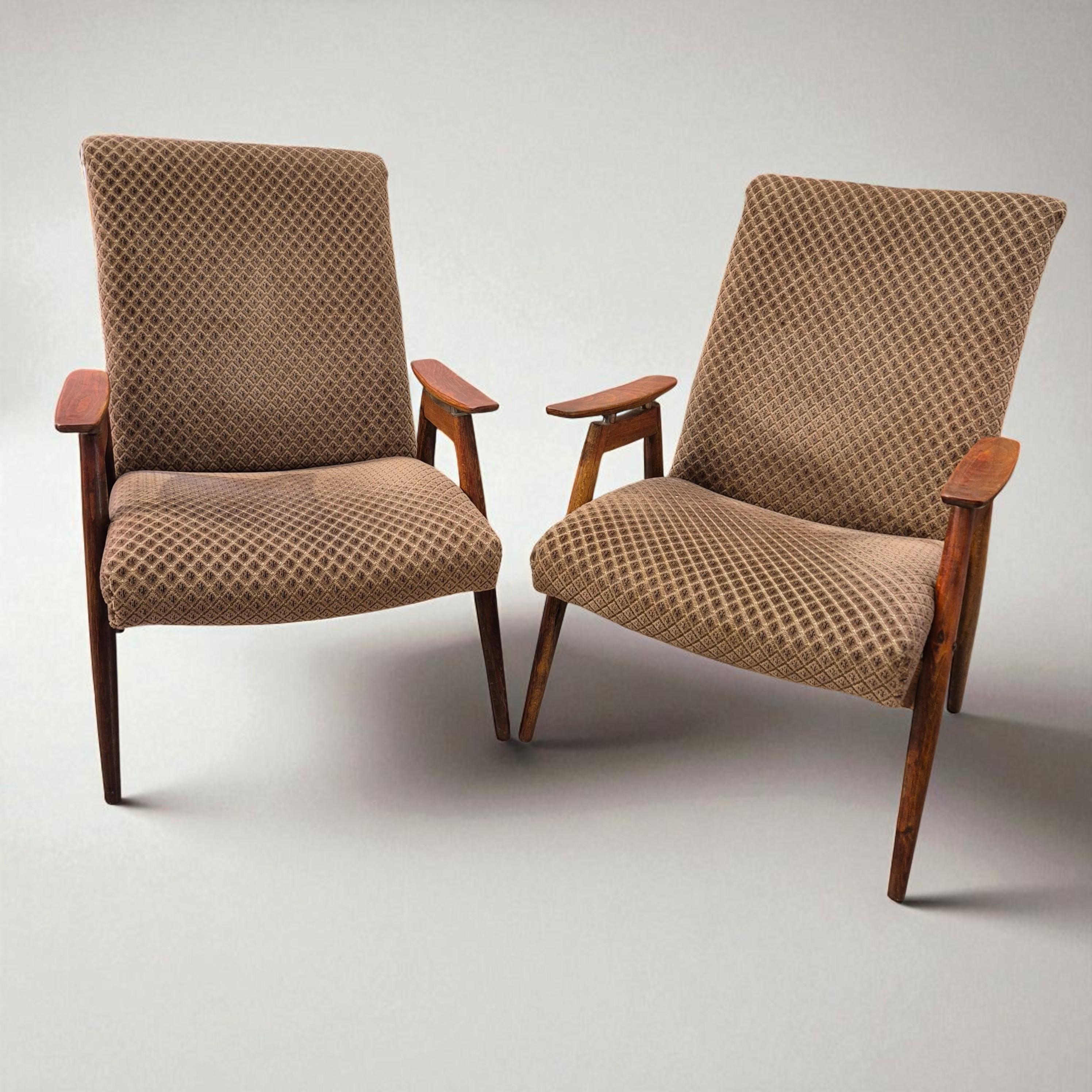 This elegant pair of Mid-Century Modern lounge chairs embodies the minimalist sophistication and warm craftsmanship characteristic of 1950s–60s European design. With their clean lines and timeless silhouette, these chairs offer a refined balance of