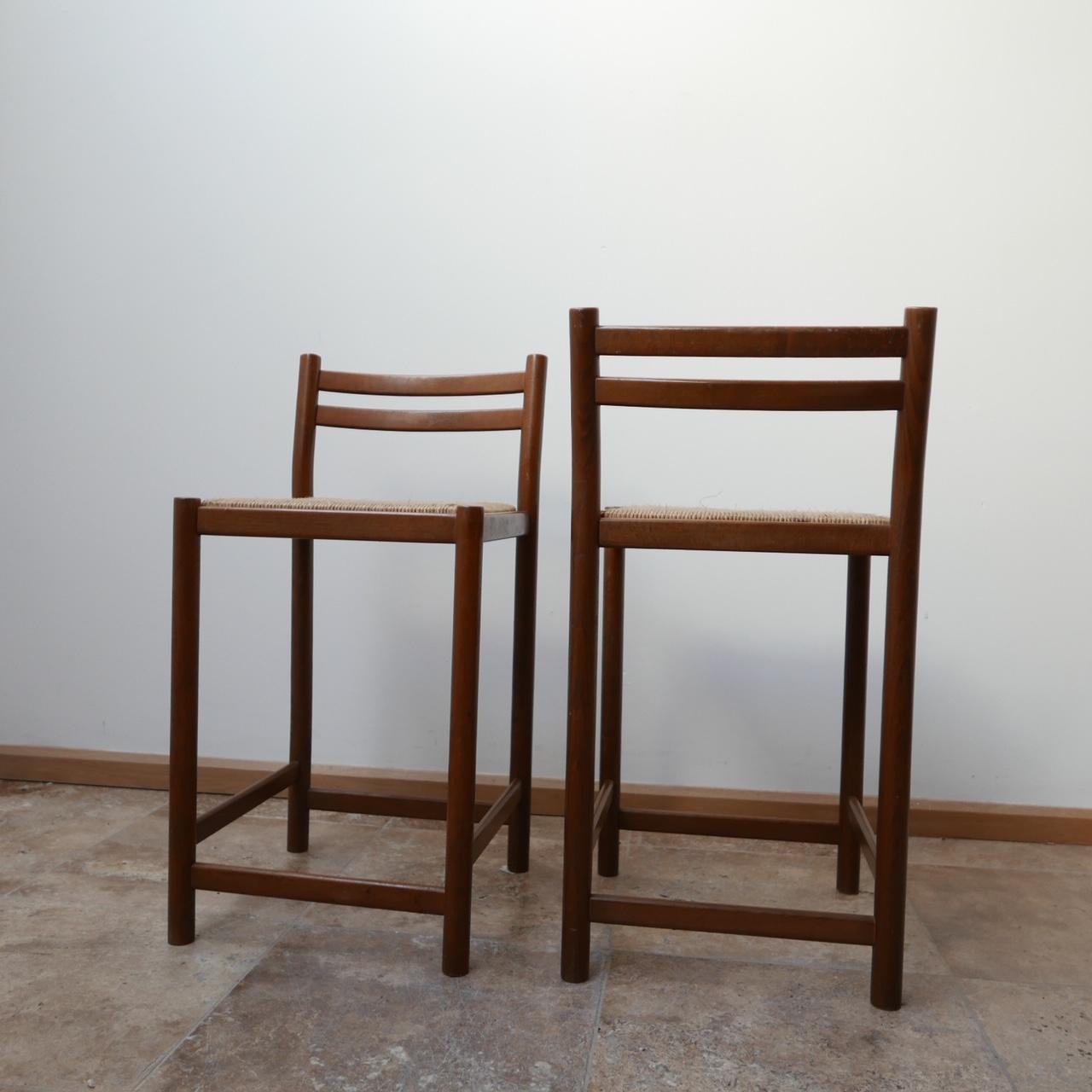 Midcentury bar stool pair,

circa 1970s, England.

Rush seats, some shrinkage but otherwise very good condition. 

Price is for the pair. 

Dimensions: 36.5 W x 38 D x 54 seat height x 75 total height in cm.