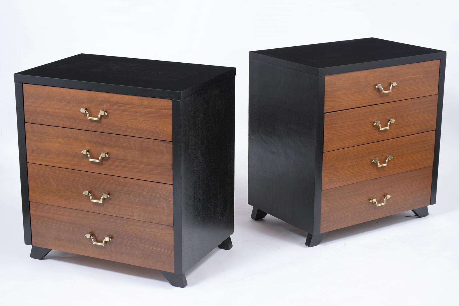 A pair of mid-century modern dressers handcrafted out of mahogany wood and features a newly ebonized and rich mahogany color combination with a lacquered finish. These chests come with four drawers each that offer plenty of storage space and all the