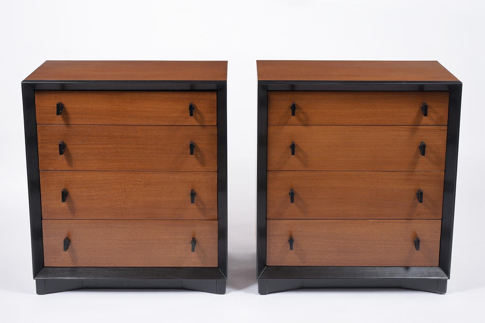 An extraordinary pair of midcentury chest of drawers in the manner of Paul Frankl handcrafted out of mahogany wood and features mahogany and ebonized color combinations with a lacquered finish. The chest comes with four drawers each with two