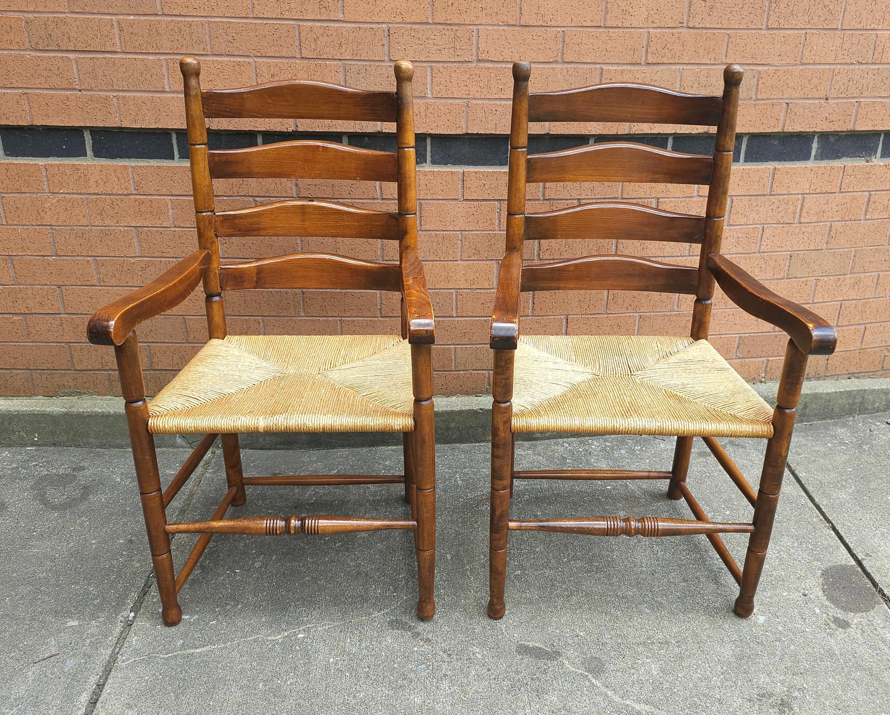 Pair of Mid Century Maple and Rush Seat Armchairs . Measures 21.5