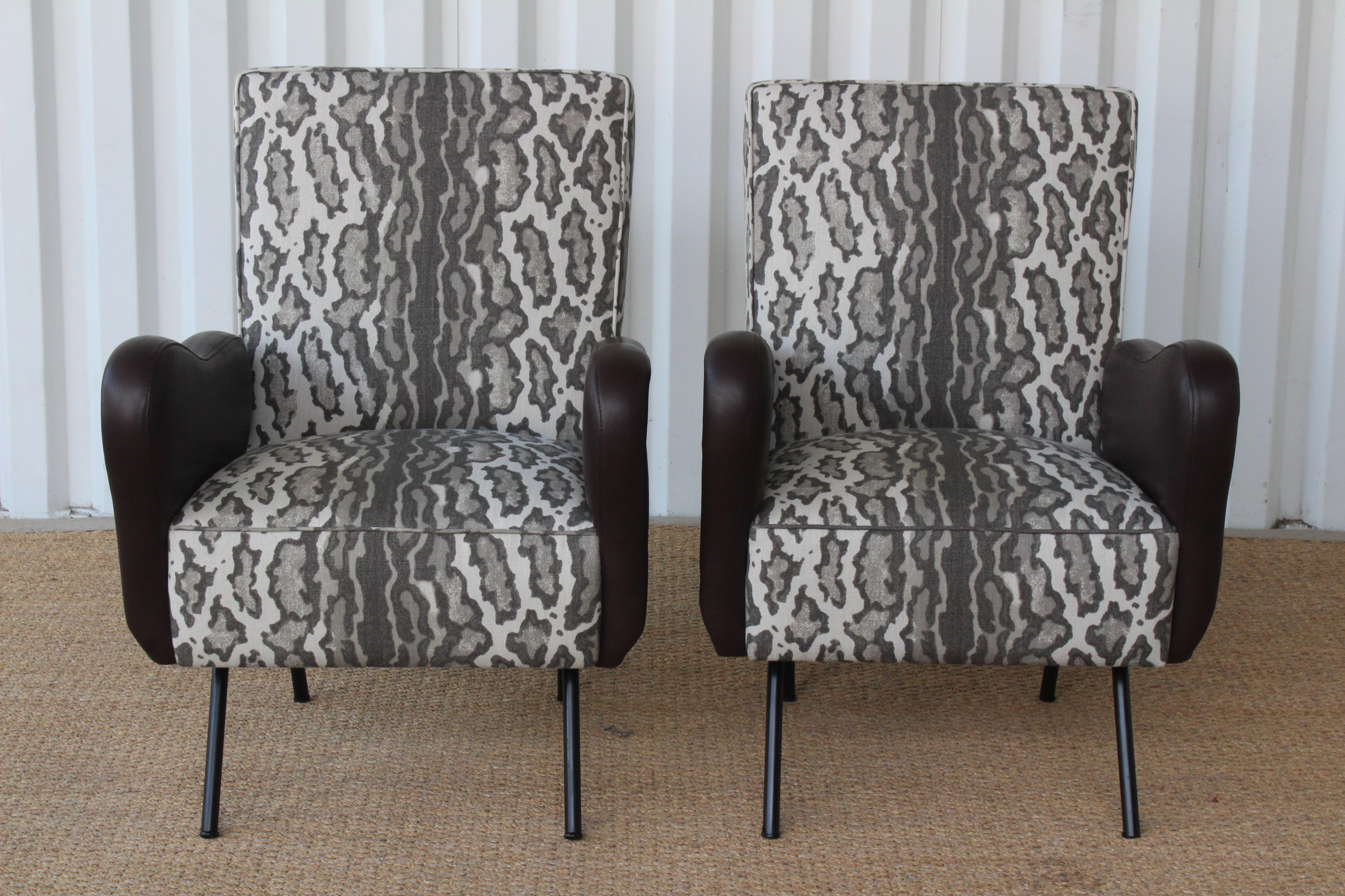 Pair of vintage mid-century chairs in the style of Marco Zanuso, Italy, 1950s. The pair have been restored with new brown leather upholstered arms and upholstered seat and back in Peter Dunham Textiles 