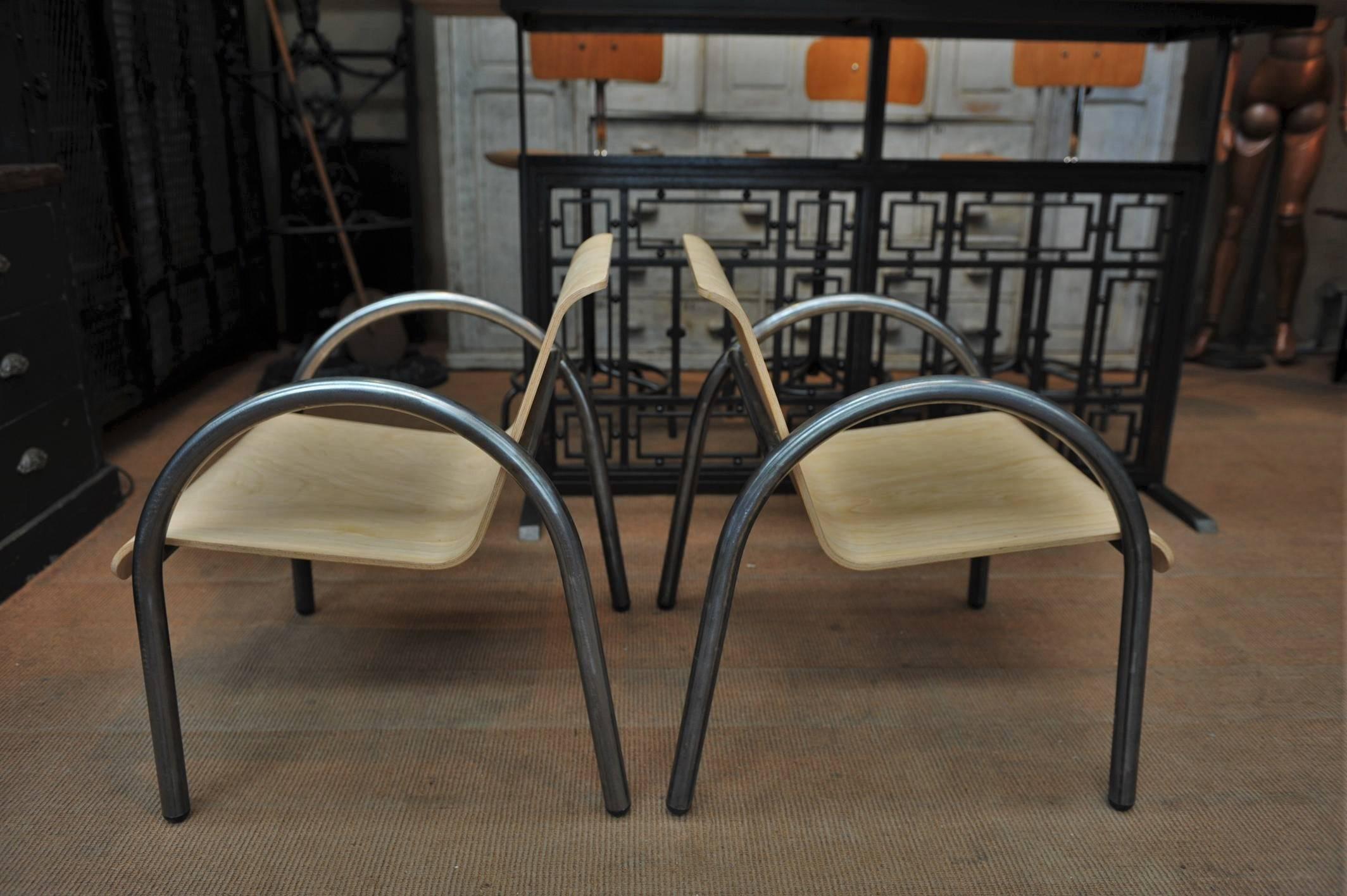 Pair of French stackable armchairs iron structure and plywood seat, circa 1950. 
 