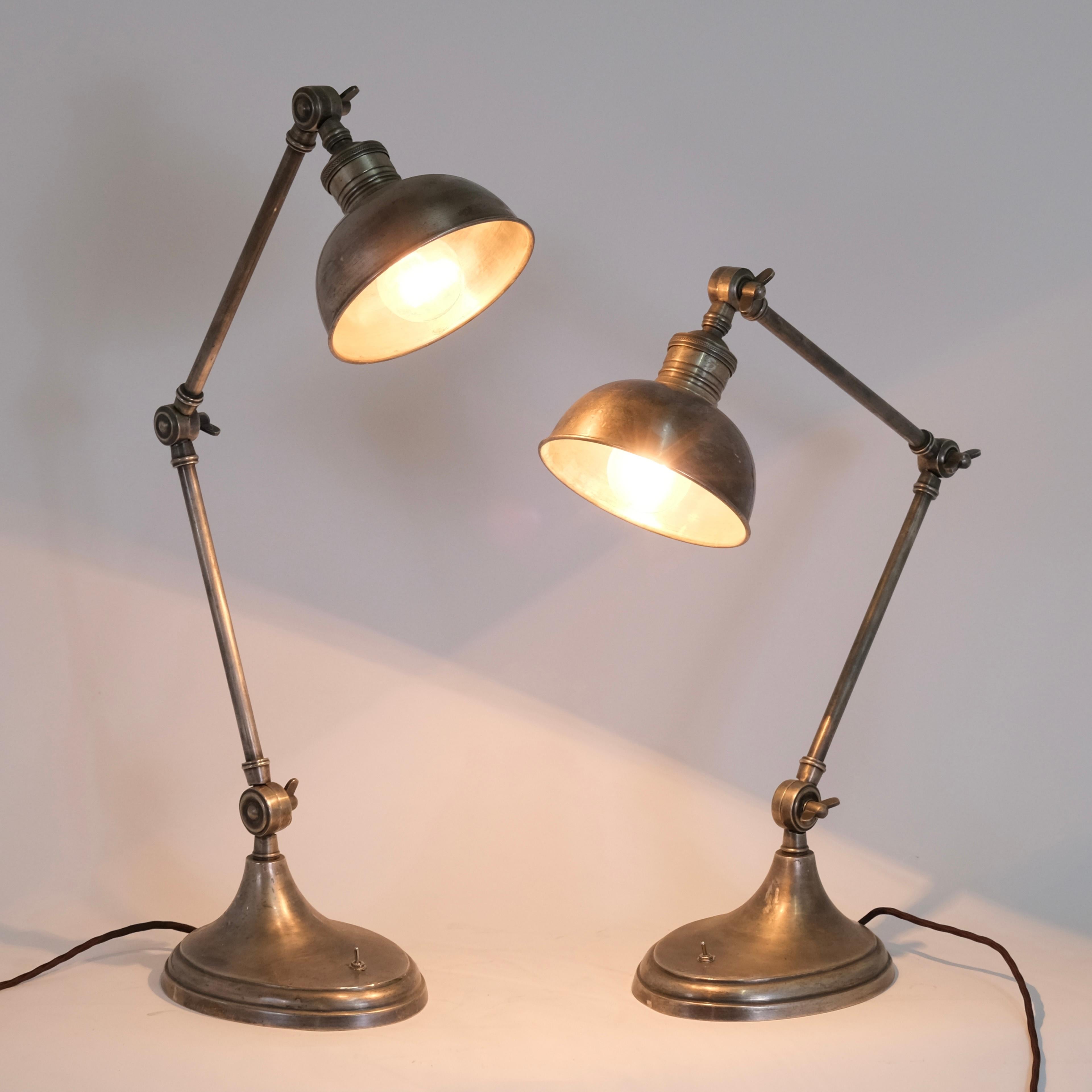 Two table lamps with flexible arms
Metal with original patina

Mid Century, 1950/60s

Dimensions:
Base: 20x16 cm
Height: 48-67 cm
Diameter Shade: 15 cm
Socket: E27 