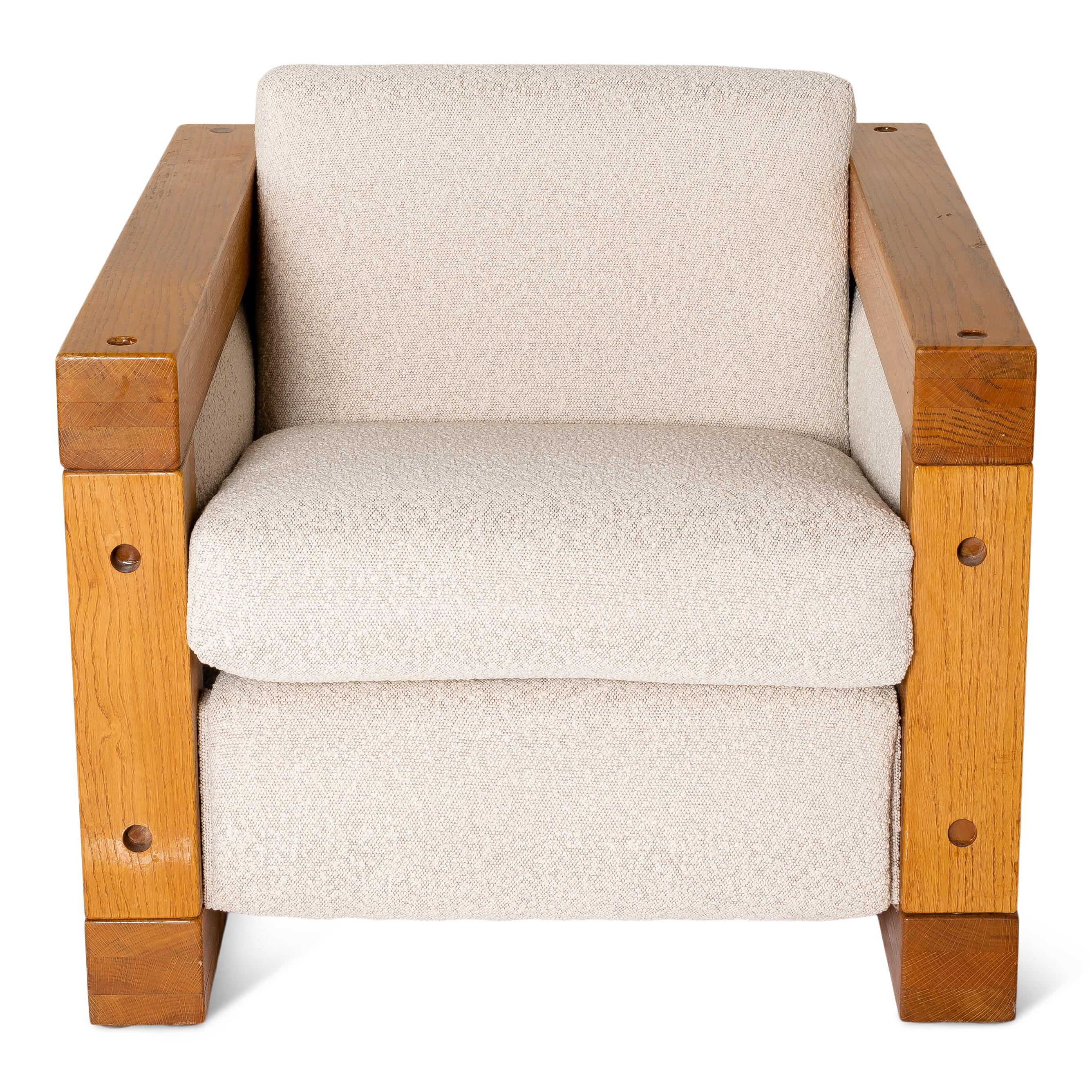 Unique pair of Mid-Century Modern Mexican club chairs with a beautifully textured fabric and structured oak frame.