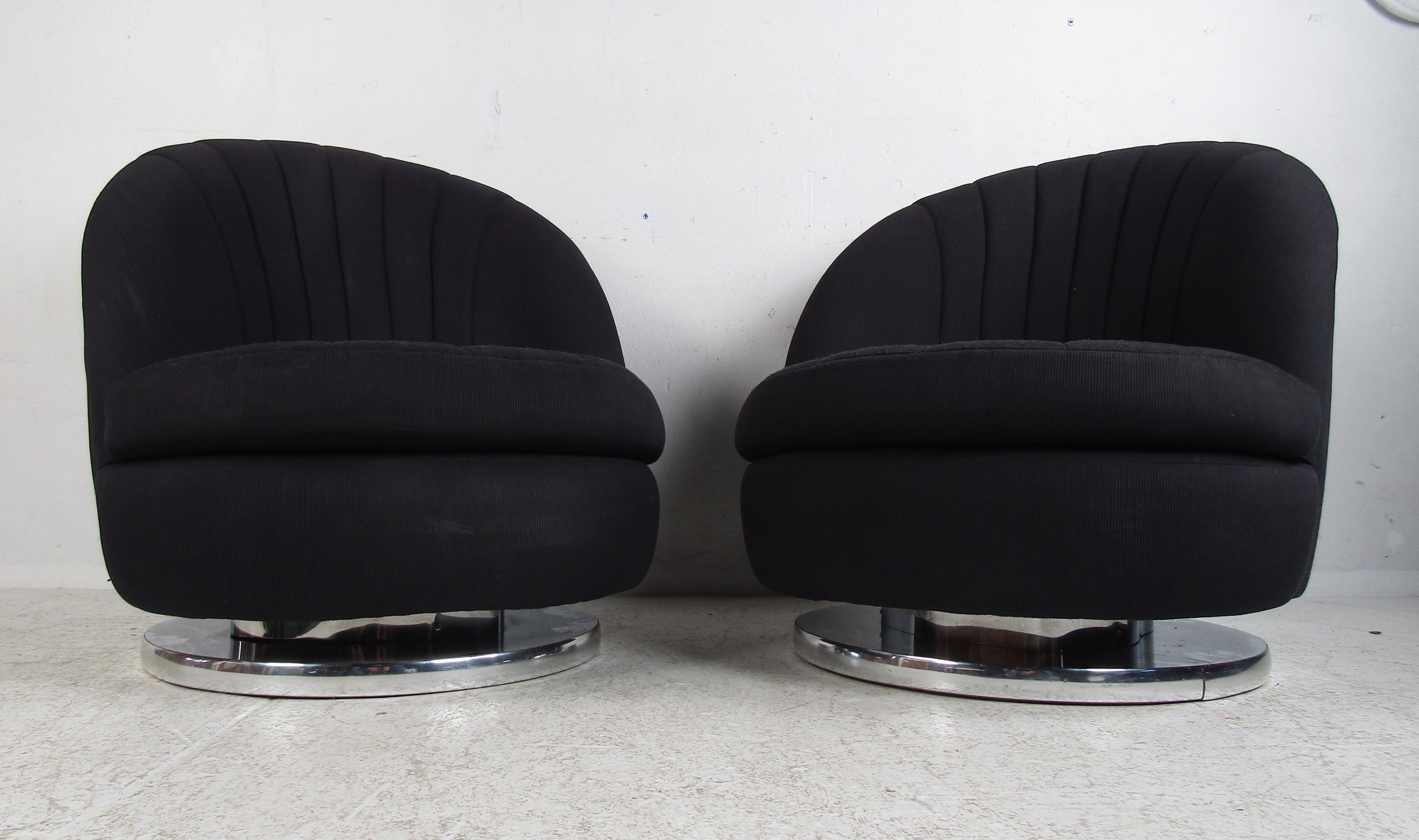 This stunning vintage modern pair of lounge chairs float on top of a circular chrome trim swivel base. The shell backrest and removable seat cushions boast the perfect contours ensuring maximum comfort. This lovely slipper chair with plush black