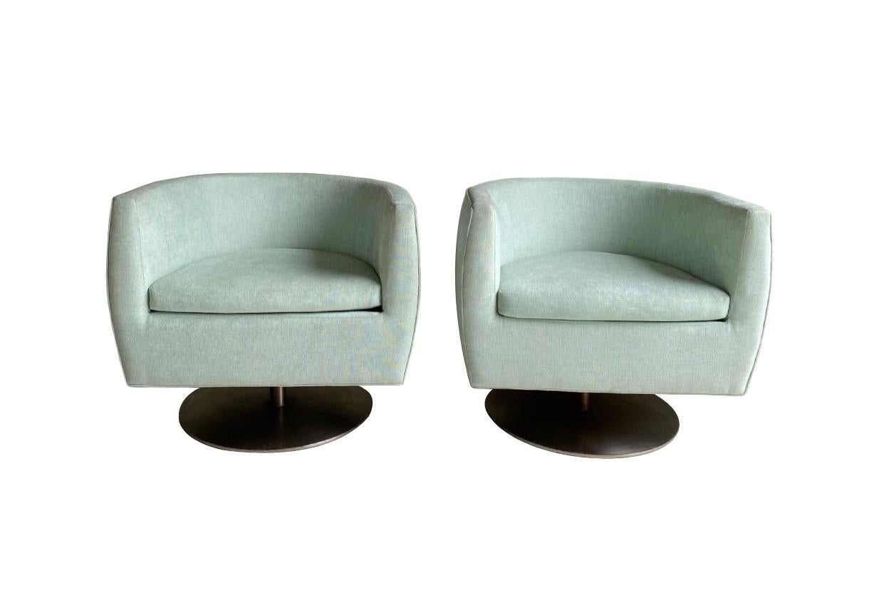 Revitalize any interior with the subtle, sophisticated glamour of these Milo Baughman style swivel chairs. Defined by clean lines and architectural simplicity, expresses an acute awareness of the evolution of design. Offering a modern twist on the