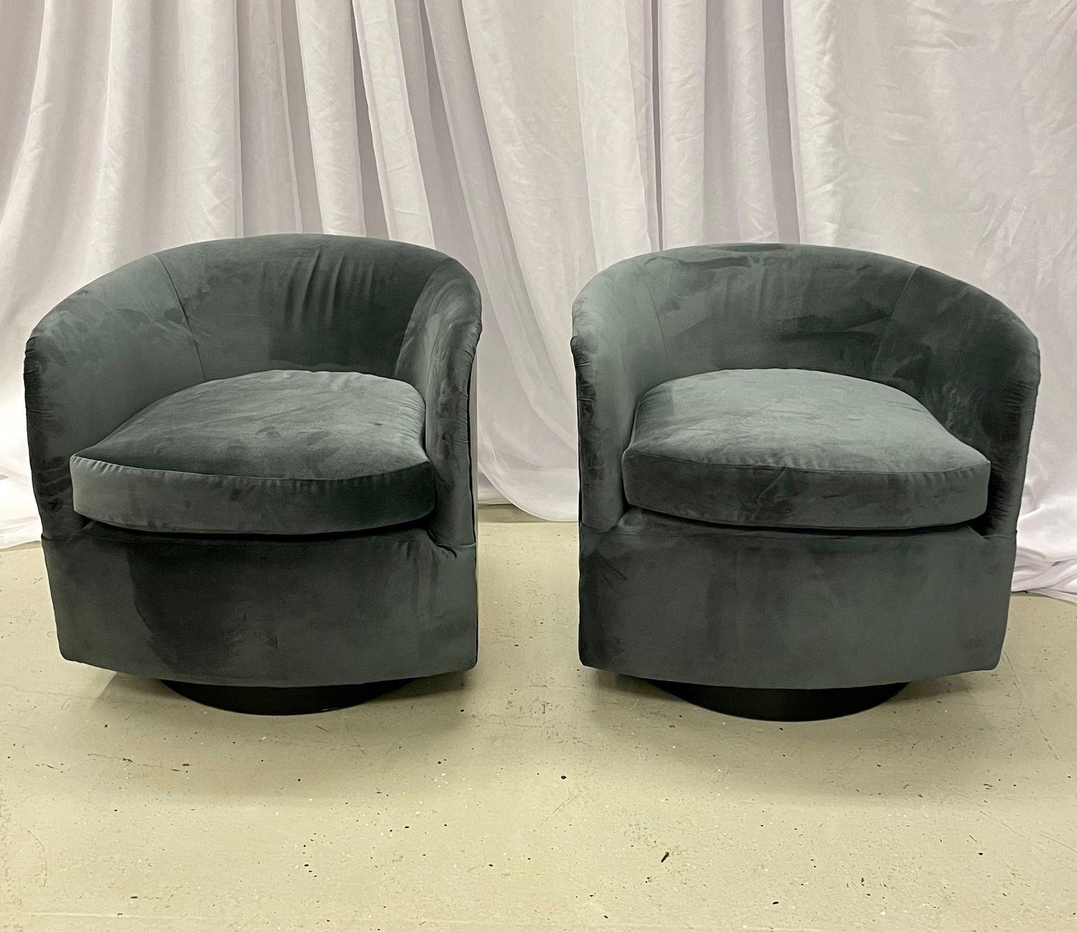 Pair of Milo Baughman Style Swivel / Lounge Chairs, Ceruse Oak, Velvet
 
Mid-century American designer swivel chairs with bent plywood backs and a gorgeous black cerused oak finish. Each chair has been re-upholstered in a warm blue velvet fabric.