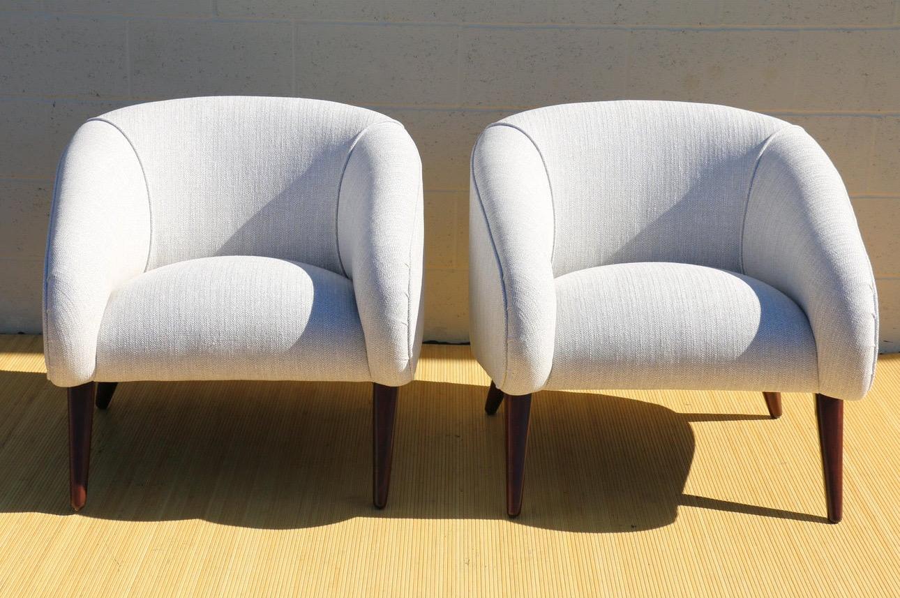 Spectacular pair of MCM lounge chairs designed by Sherman Bertram in the 1950’s. The chairs have no designer marks. They have been refinished and reupholstered. They’re absolutely very well maintained. These chairs are wonderful, sturdy, and