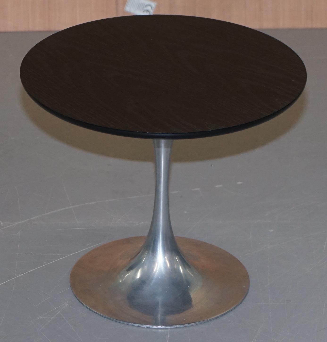 We are delighted to offer for sale this lovely pair of original 1960s A Arkana Tulip side tables with ebonised tops and chrome bases

Both tables are stamped inside A Arkana although one stamp is partially missing. The tops are ebonised ash wood