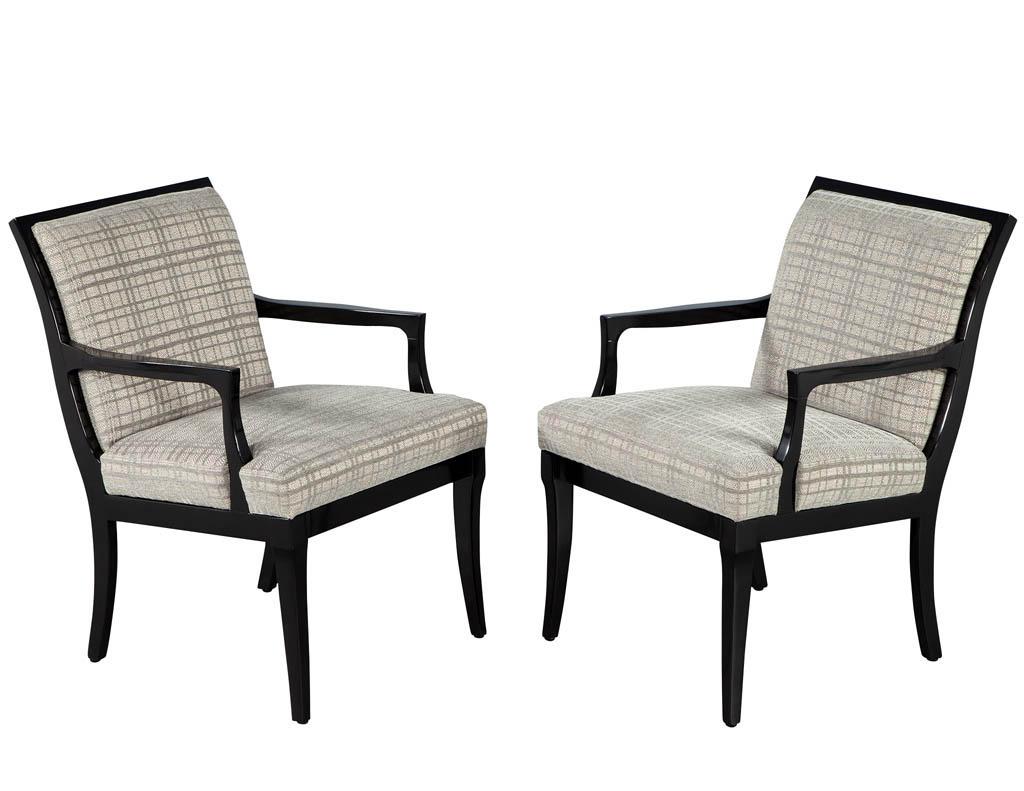 Pair of Mid-Century Modern Accent arm chairs. American, circa 1960’s. Restored in beautiful patterned fabric with black lacquered frame. Price includes complimentary curb side delivery to the continental USA.