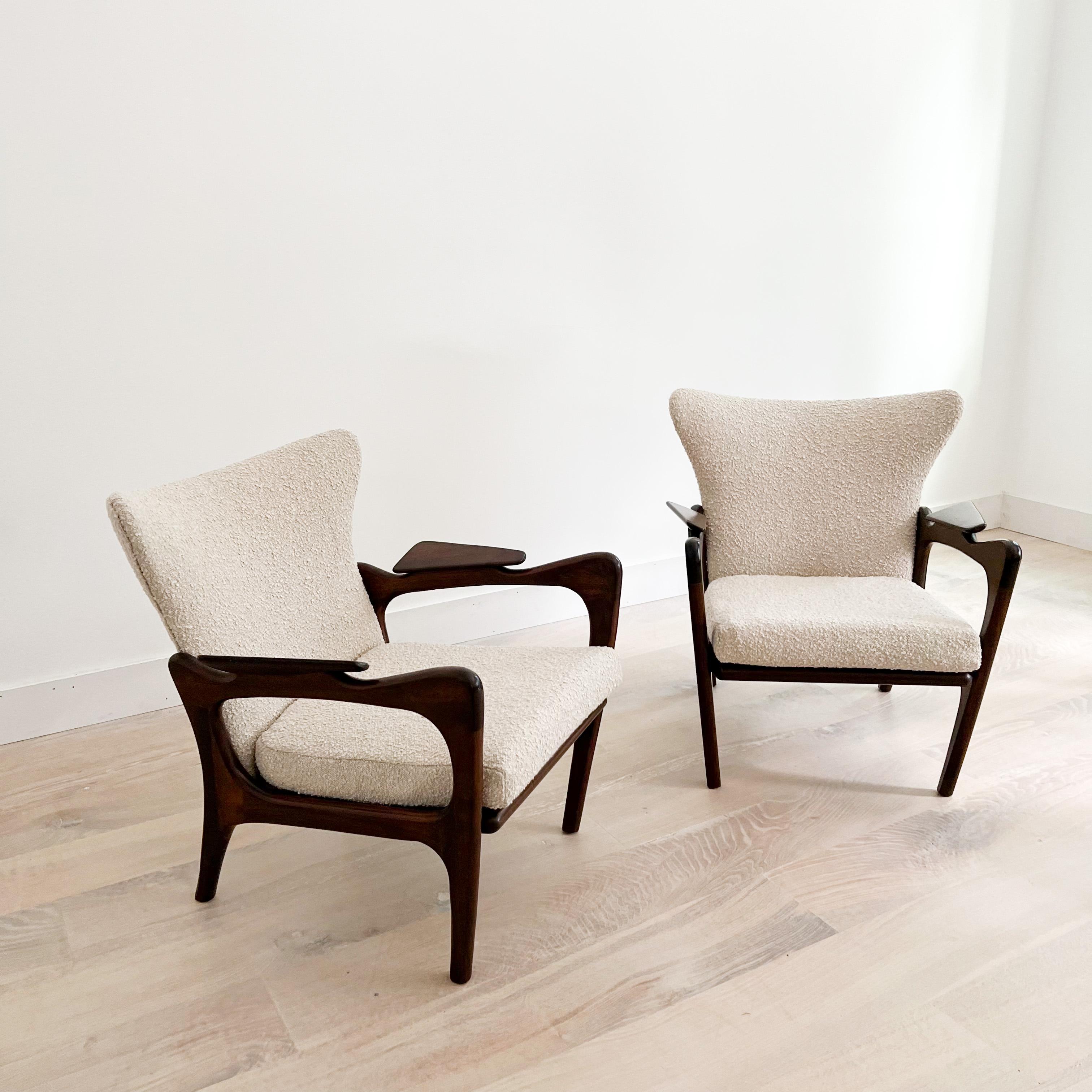 Pair of Mid-Century Modern wingback lounge chairs designed by Adrian Pearsall for Craft Associates. The sculpted solid walnut wood frames are in good condition overall with only light scuffing/scratching from age appropriate wear. New professional