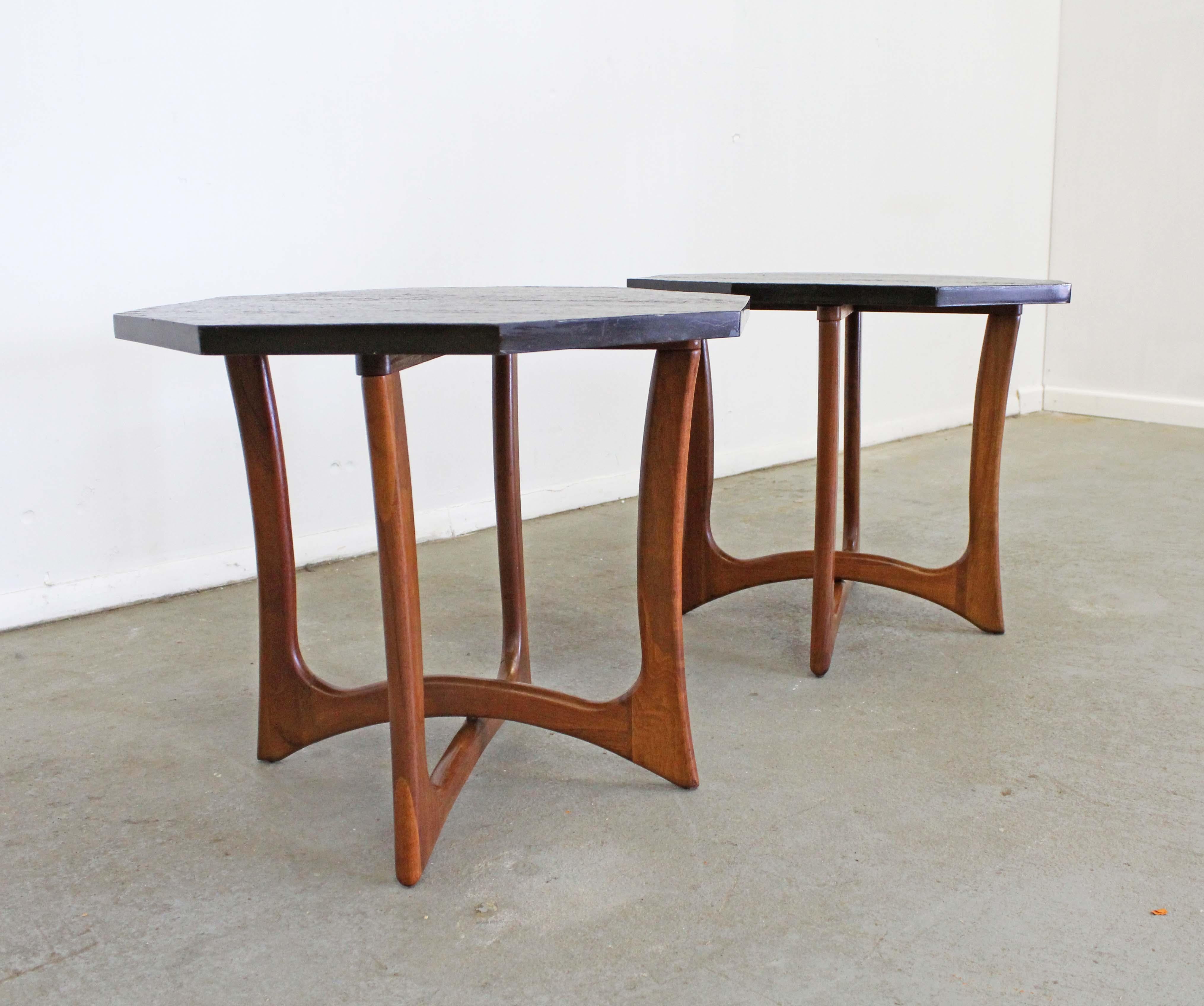 Offered is a pair of beautiful end tables designed by Adrian Pearsall fpr Craft Associates. These tables feature beautifully sculpted wood bases and removable hexagonal slate tops. They're in overall good condition with some age wear. Slate tops