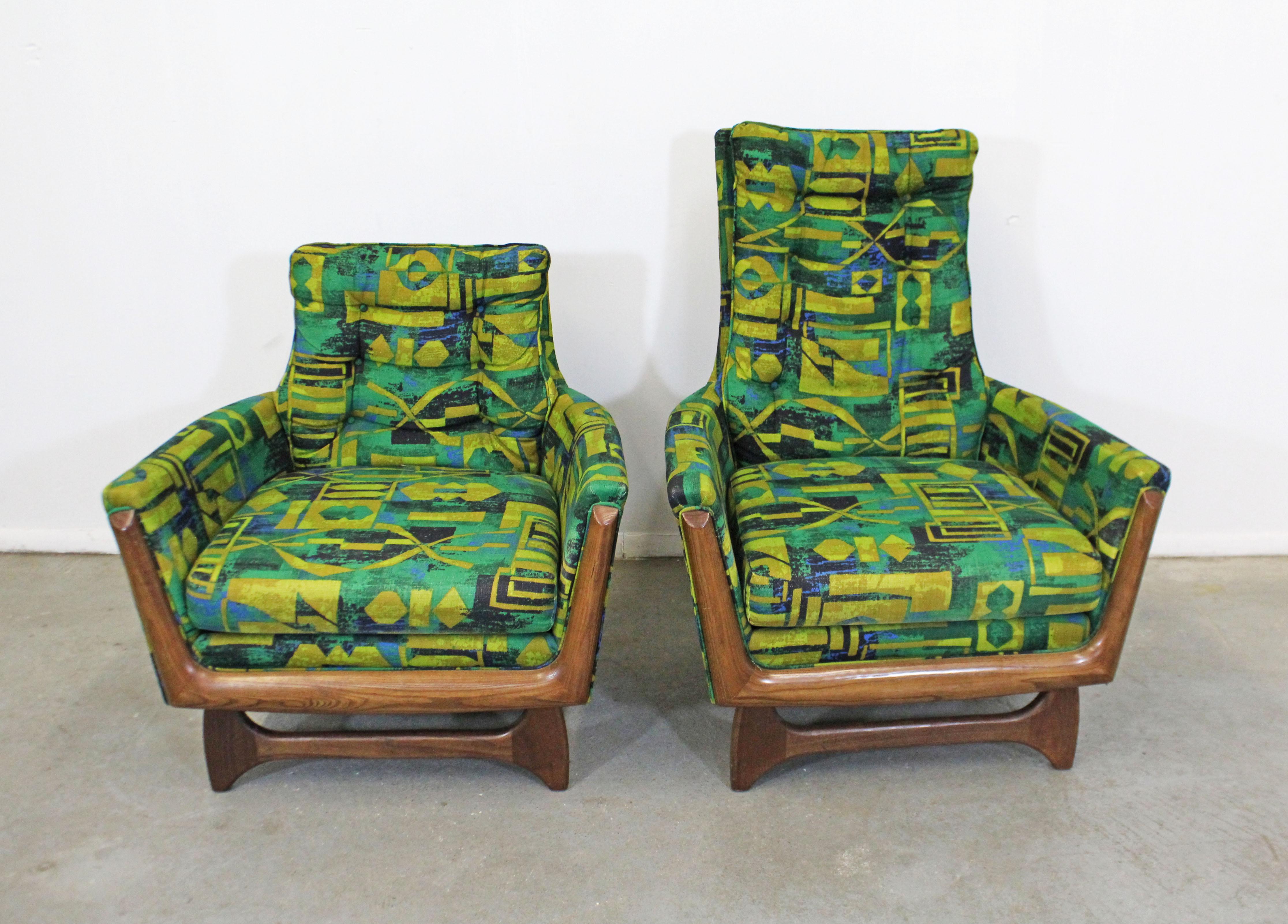 Offered is a pair of gorgeous Mid-Century Modern lounge chairs similar to the style of Adrian Pearsall. Absolutely incredible lines on these chairs. Features original upholstery with tufted back cushions. Includes arm covers. They are in good