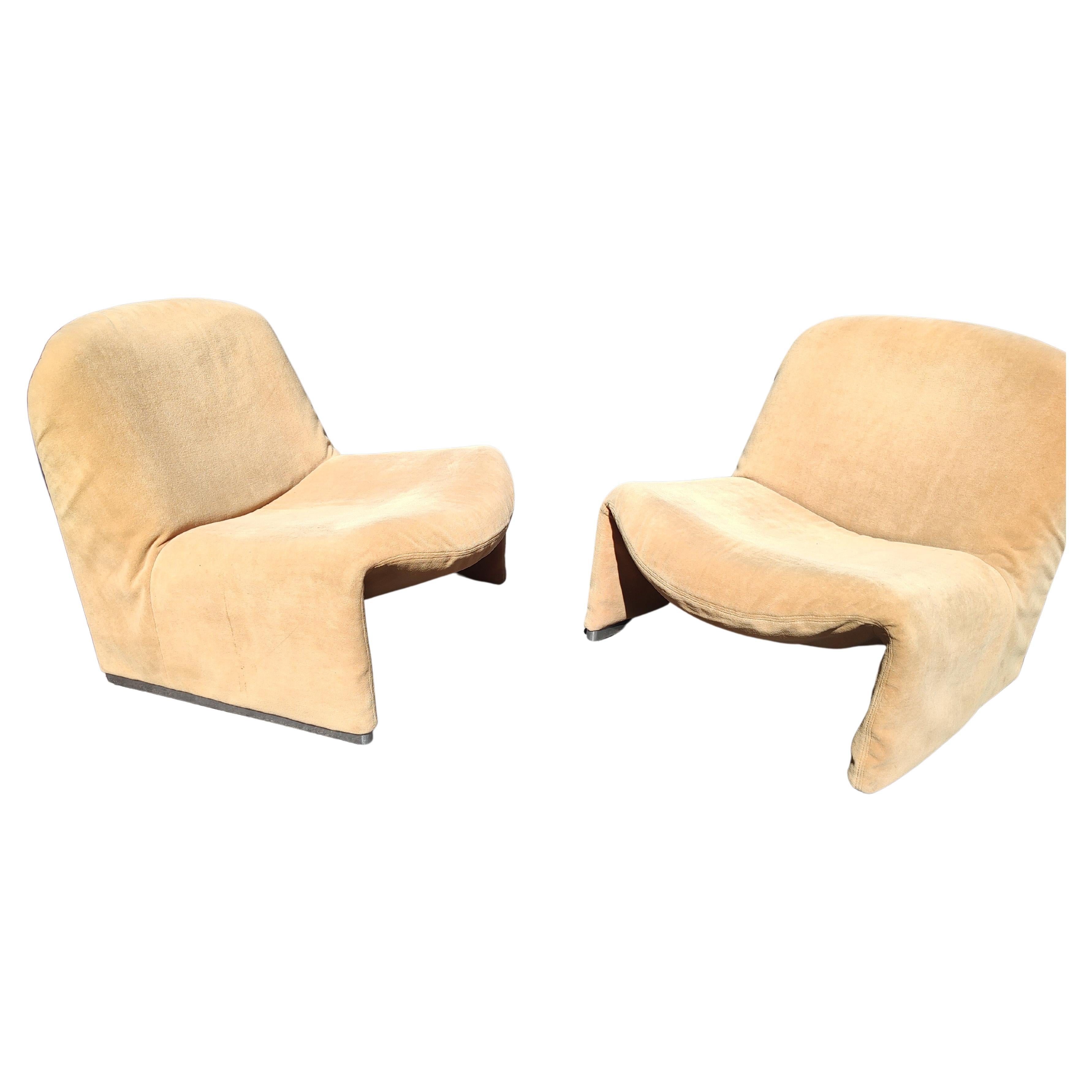 Fantastic pair of vintage 1969 Alky chairs designed by Giancarlo Piretti for Artifort. In what appears to be original fabric which shows wear from normal use and age. Aluminum feet and foam padding totally intact and ready for a makeover. Priced and