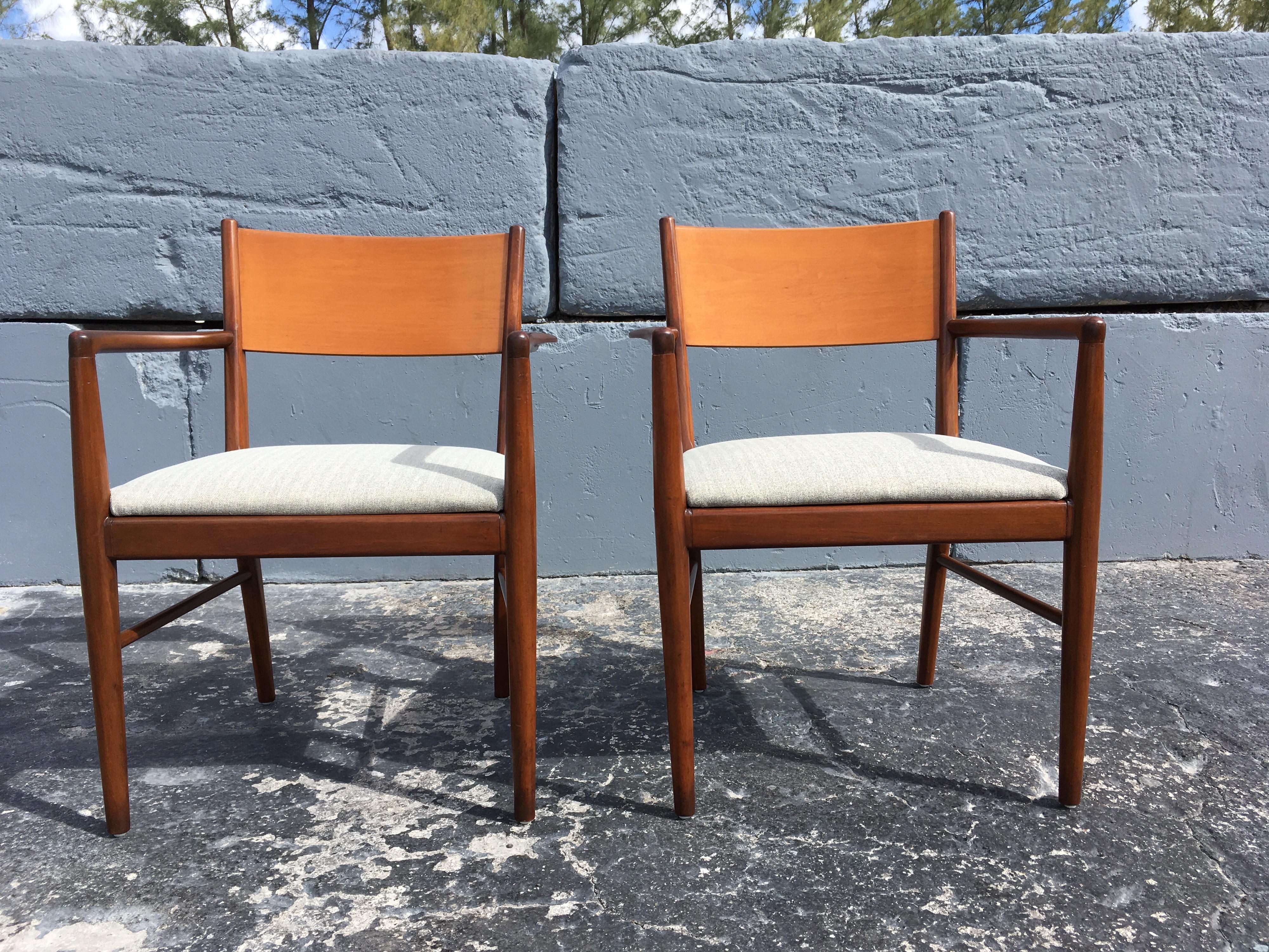 Great chairs in the style of Finn Juhl. Arm height is 25.25”.