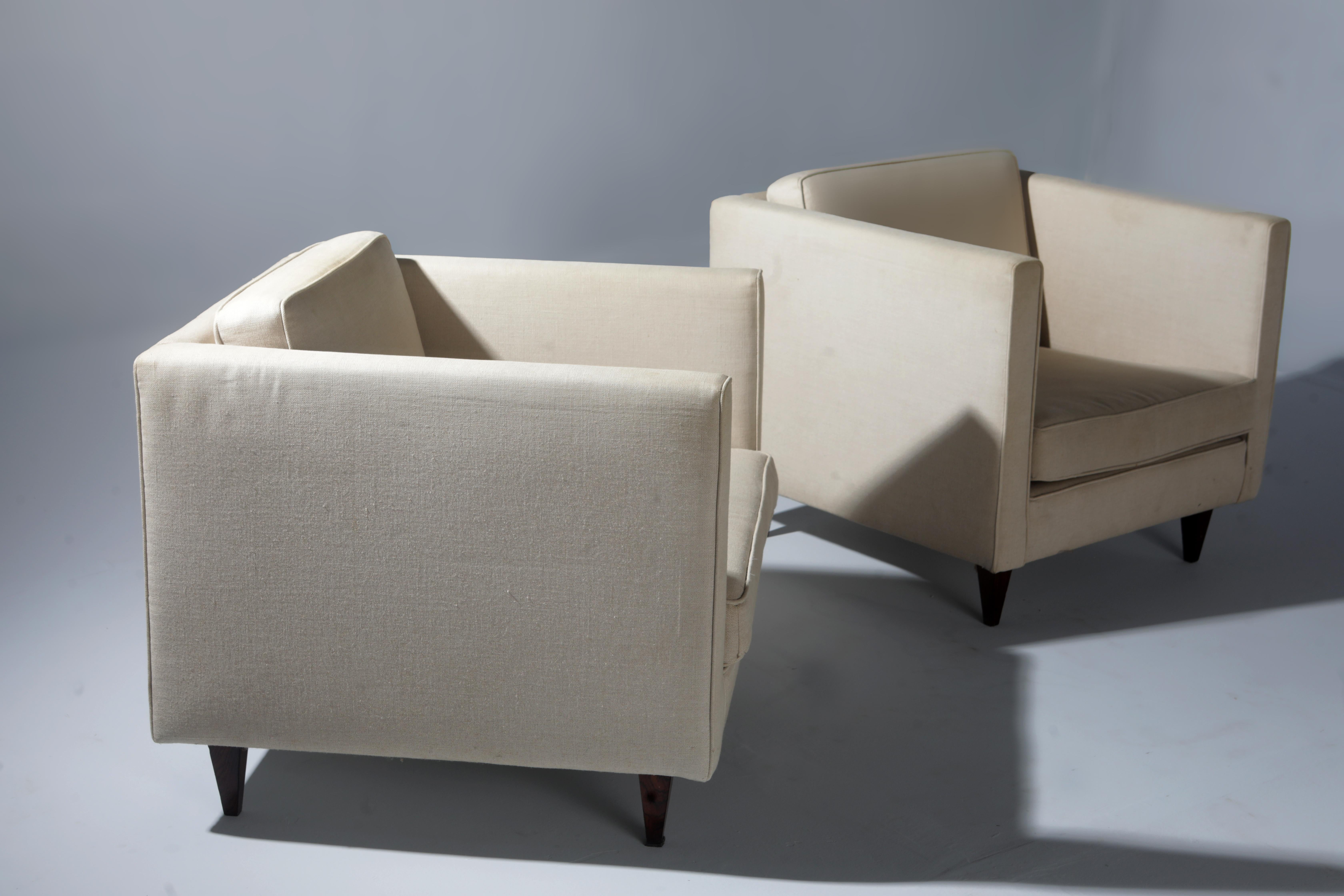 Pair of Mid-Century Modern armchairs by Joaquim Tenreiro, Brazil 1960s

This pair of square armchairs designed by Joaquim Tenreiro is a stunning example of mid-century modern design. The armchairs feature a minimalist yet stylish design that is both