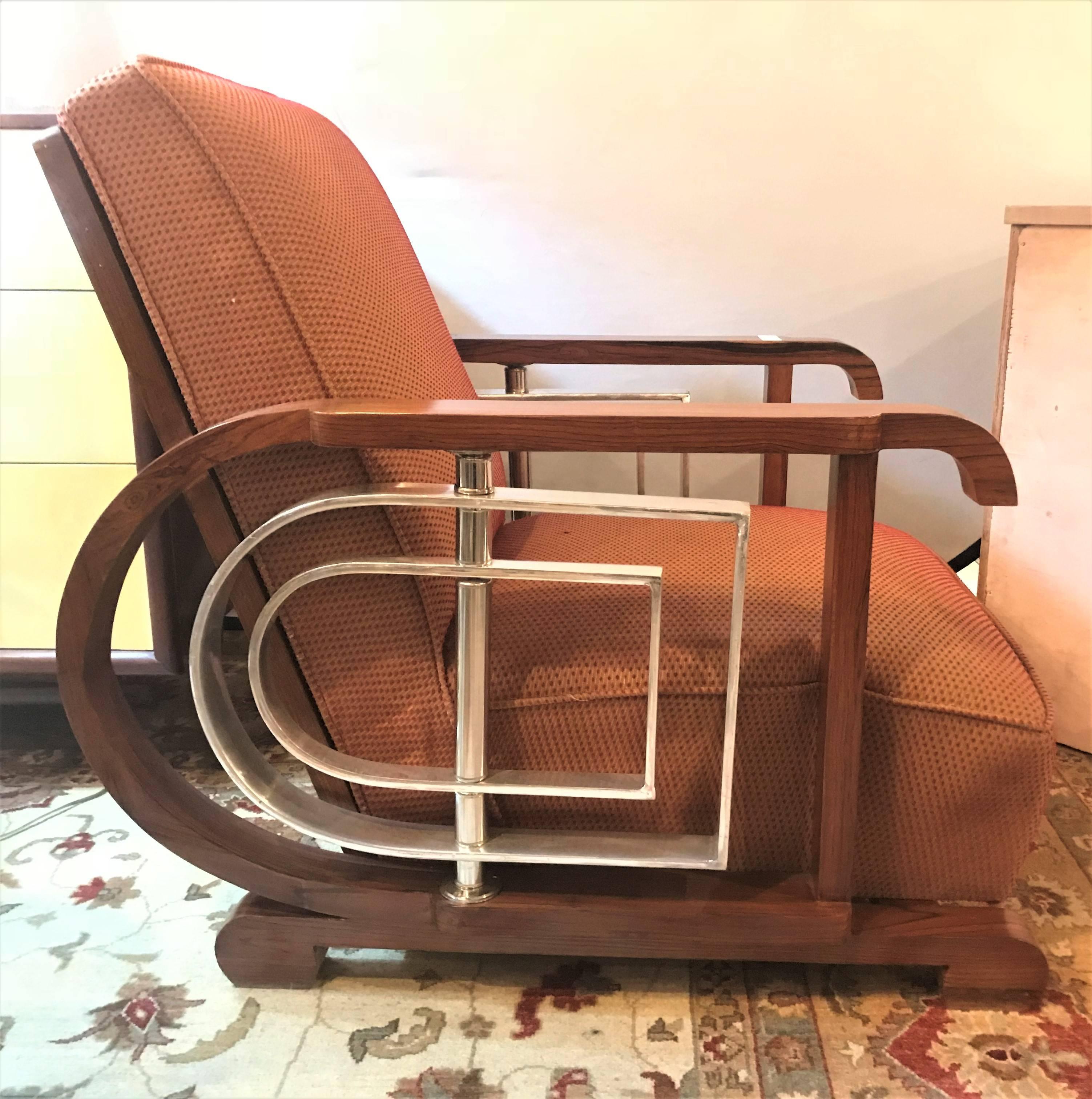 Pair of Mid-Century Modern Art Deco style lounge/ theater chairs. An outstanding set of Art Deco inspired lounge or theater chairs from the Mid-Century Modern era. Each having all new fabric with new cushions, backrest, welts and undercarriage. All