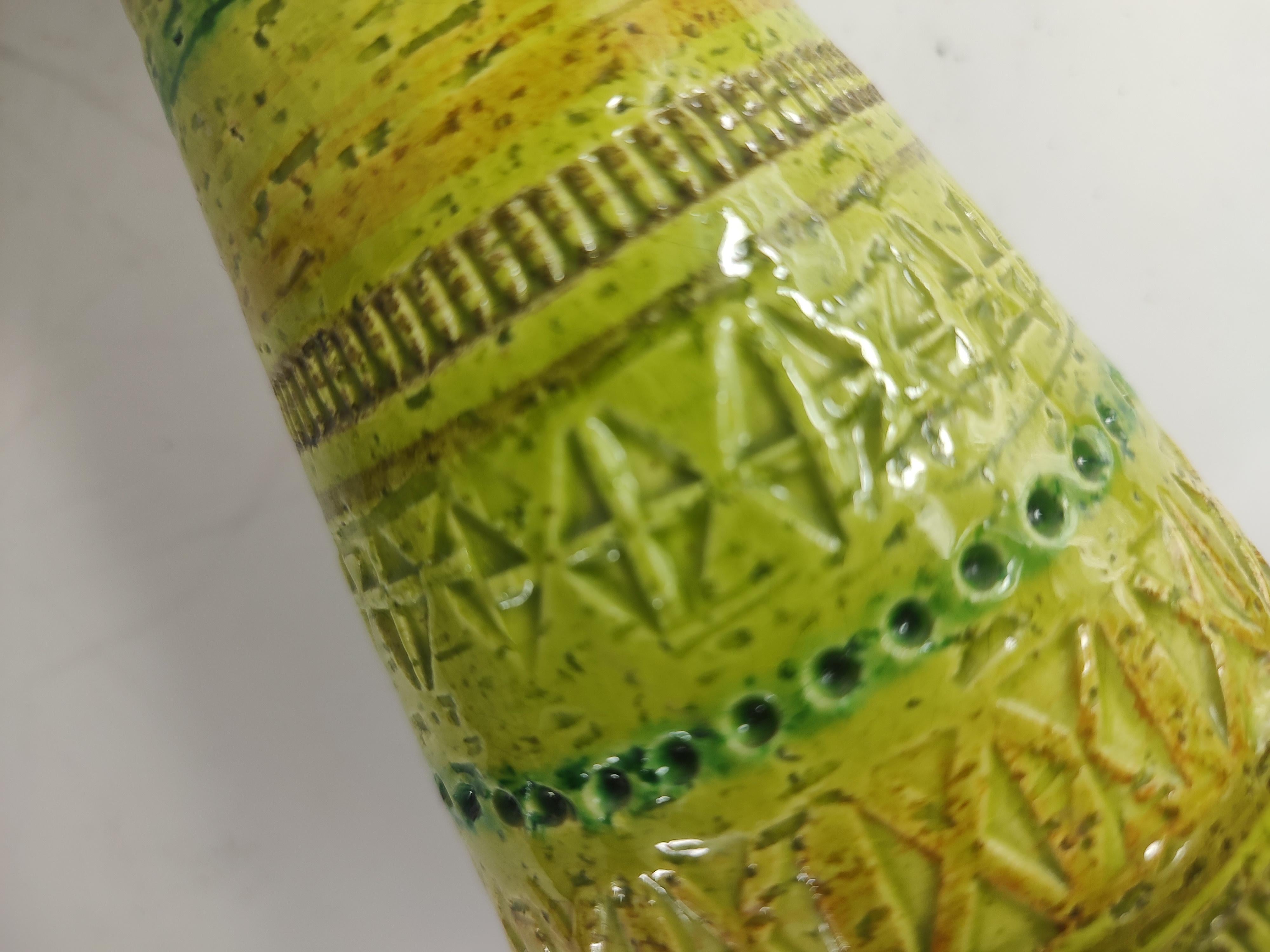 Fantastic pair of Mid-Century Modern Sculptural art pottery vases / candleholders. Amazing colors greens and yellows banded along symmetrically with archaic impressions. In excellent vintage condition with no visible chips or cracks. Priced and sold