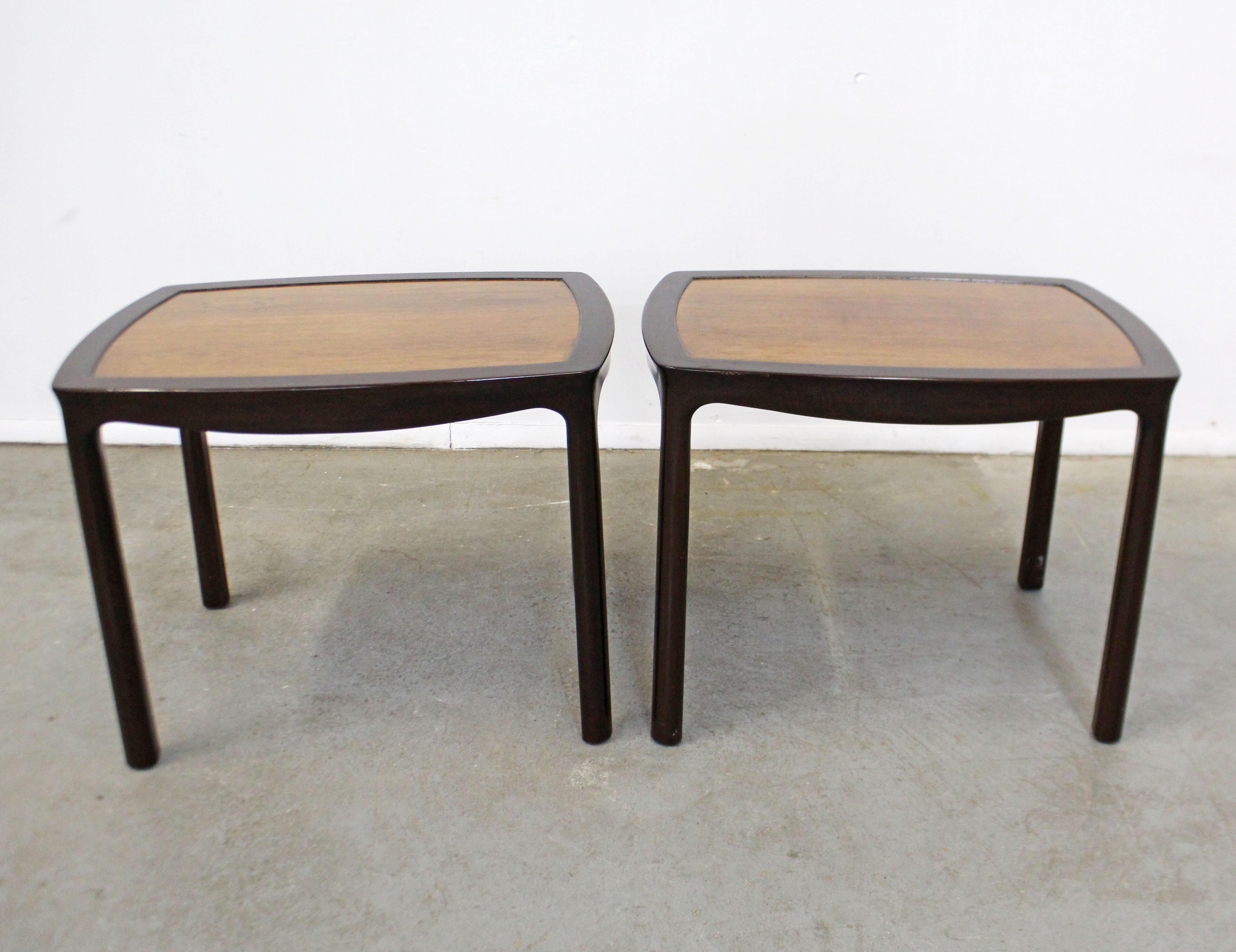 Offered is a pair of midcentury Asian Modern end tables, designed by Edward Wormley for Dunbar. These tables have ebonized mahogany bases and rosewood tops. They're in good vintage condition with some age wear including surface scratches/chips,