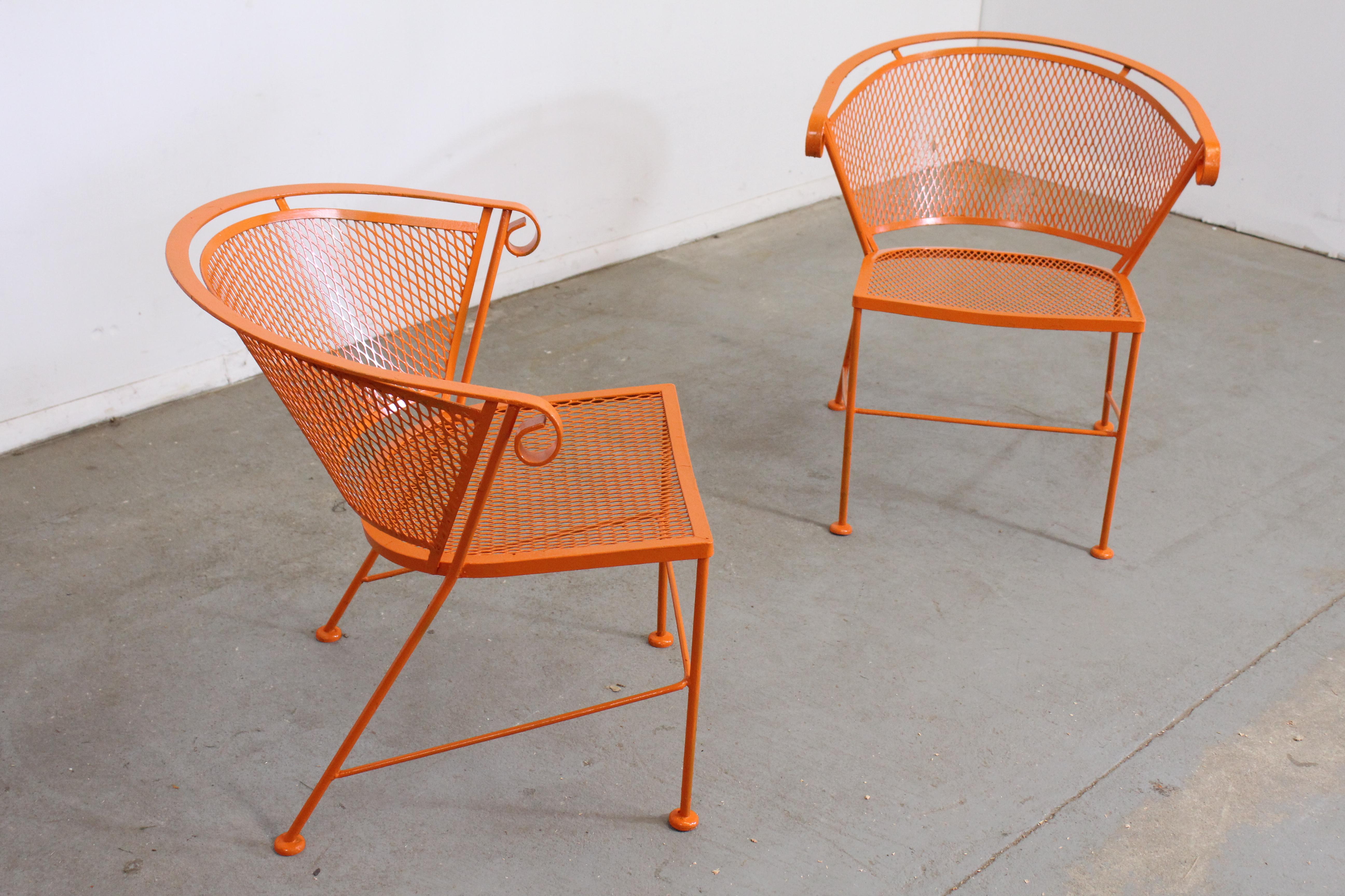 Pair of Mid-Century Modern Atomic orange outdoor metal curved back chairs

Offered is a pair of Pair of Mid-Century Modern Atomic orange outdoor metal curved back chairs, circa 1968. These chairs swivel and rock, and have been repainted in an