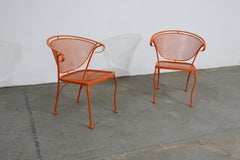 Pair of Mid-Century Modern Atomic Orange Outdoor Metal Curved Back Chairs Set B