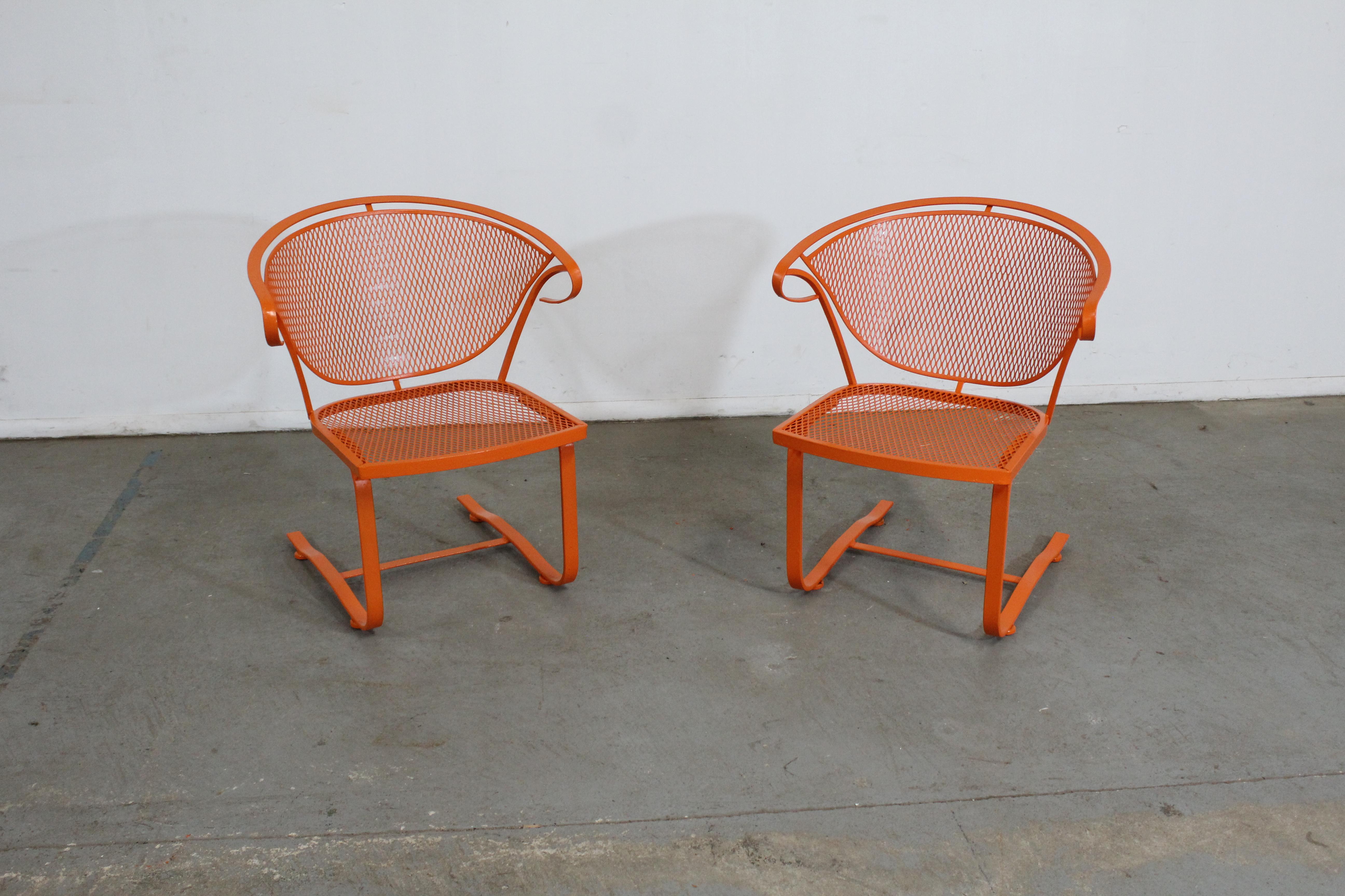 Pair of Mid-Century Modern Atomic Orange Salterini Style Outdoor Metal Curved Back Springer Chairs

Offered is a pair of Pair of Mid-Century Modern Atomic orange Outdoor Metal Curved Back Chairs, circa 1968. These chairs have been repainted in an