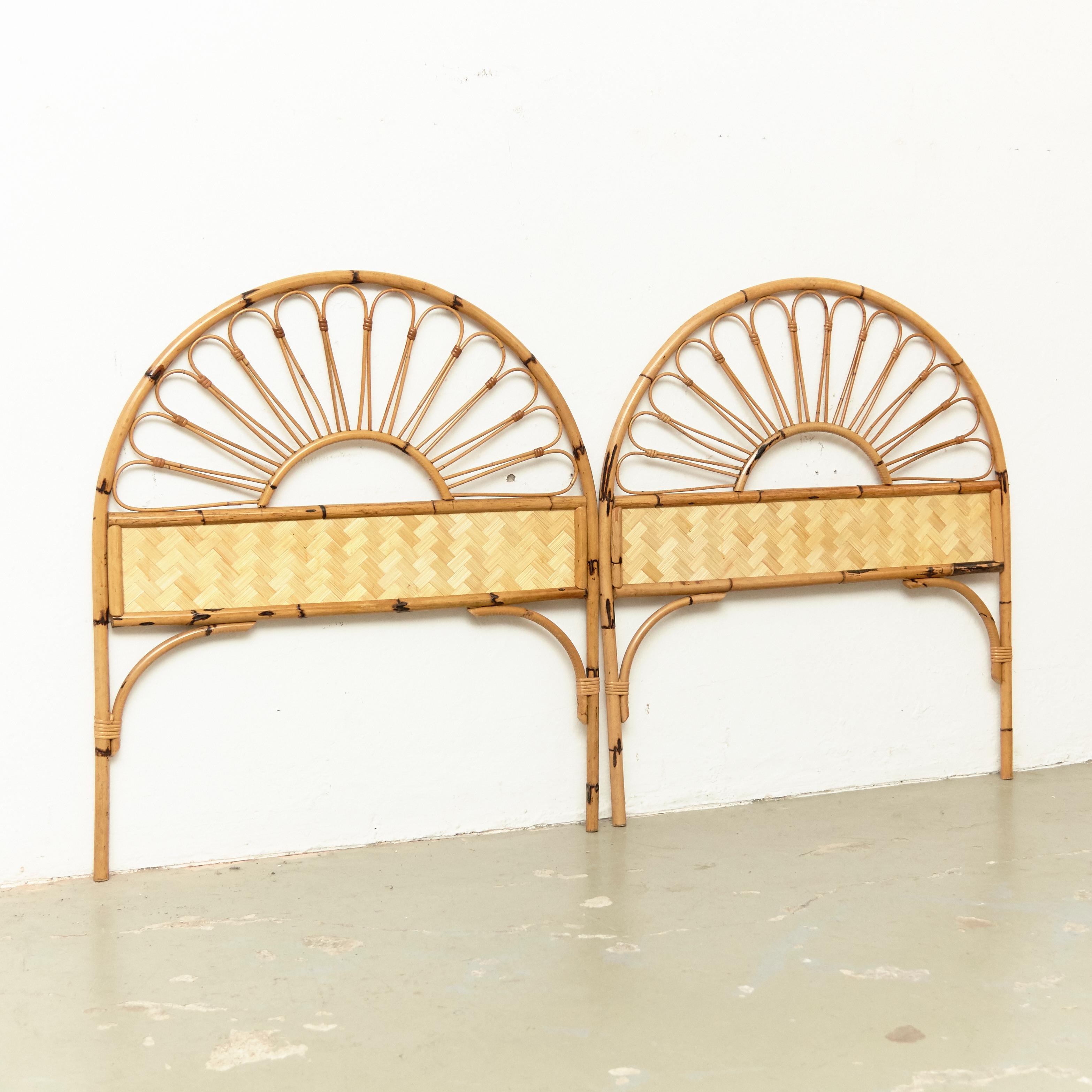 Pair of Mid-Century Modern bamboo and rattan headboard, circa 1960
Traditionally manufactured in France.
By unknown designer.

In original condition with minor wear consistent of age and use, preserving a beautiful patina.