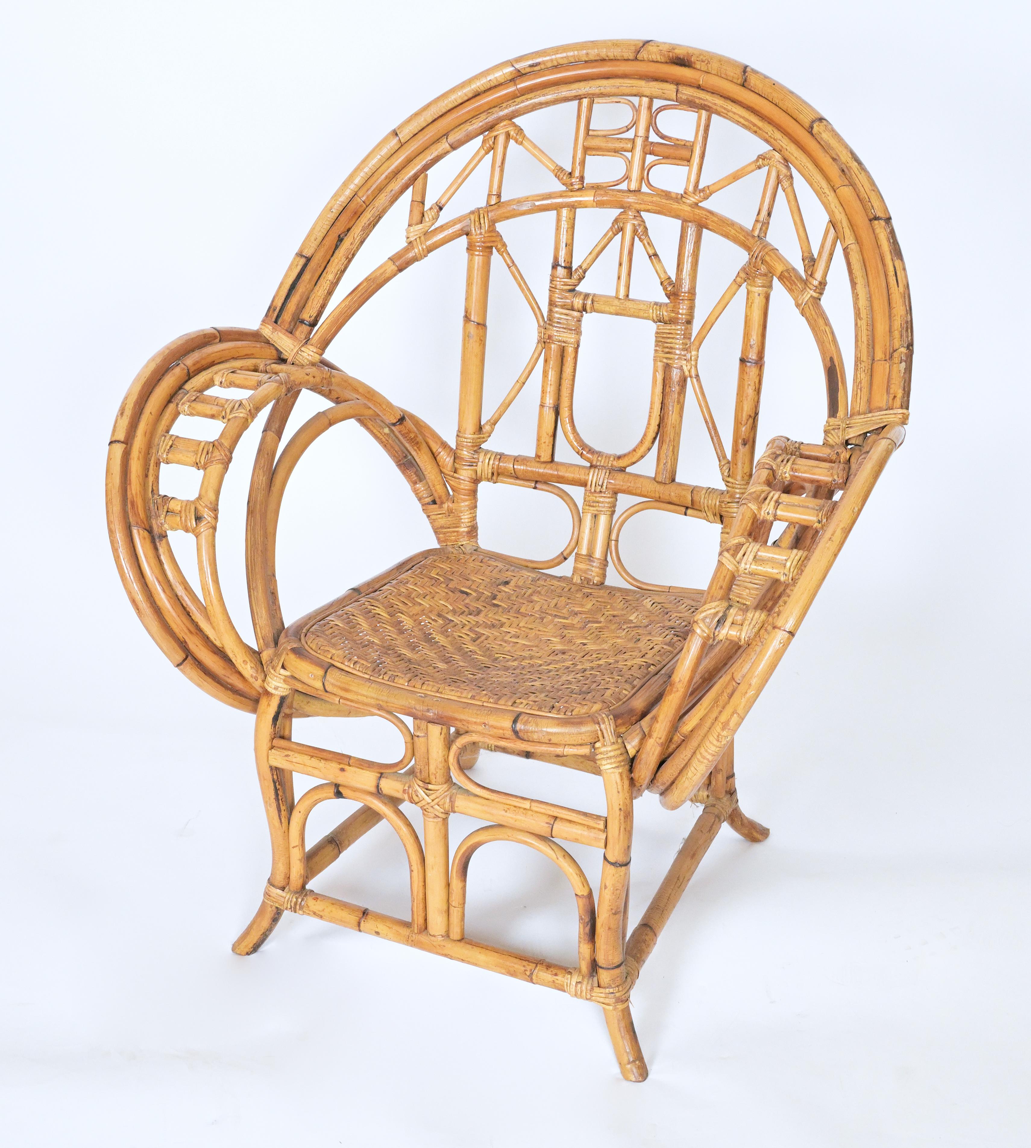 A pair of caned bamboo armchairs with tall curved backs and arms.