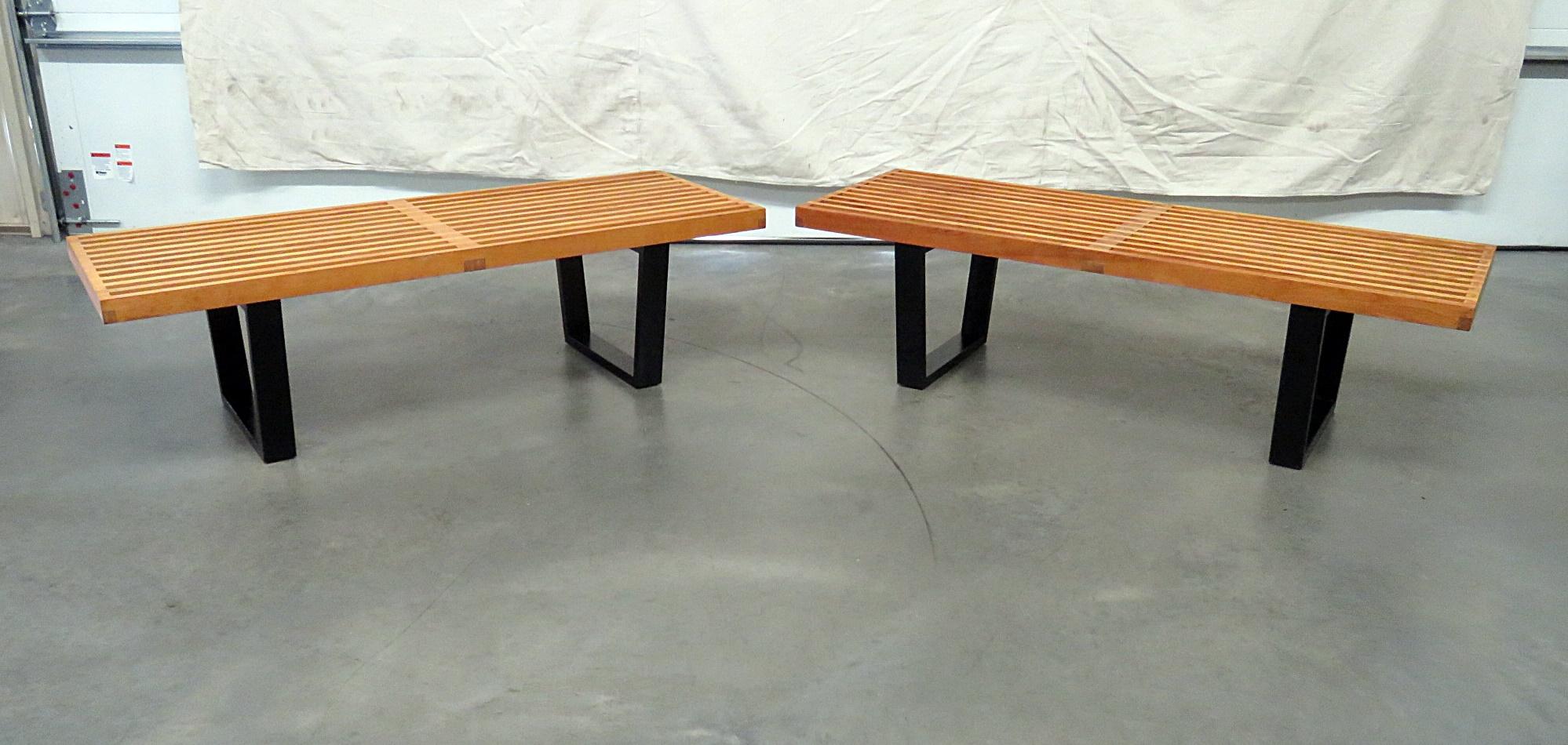 Pair of Mid-Century Modern benches, attributed to Herman Miller, with an ebonized base.