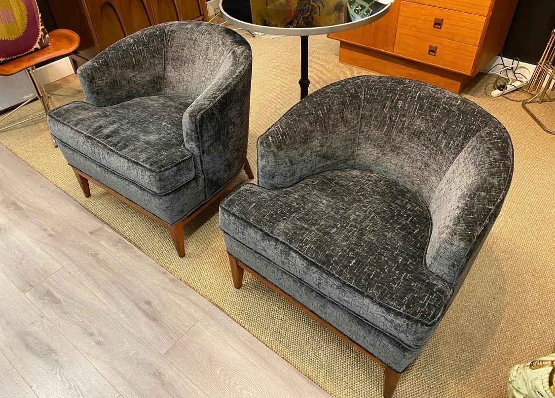 Elegant pair of matching Mid-Century Modern bespoke club chairs, circa 1960s but completely restored and reupholstered. The fabric picked is luxurious and the color is hard to describe, best to look at attached pictures. All dimensions are below.