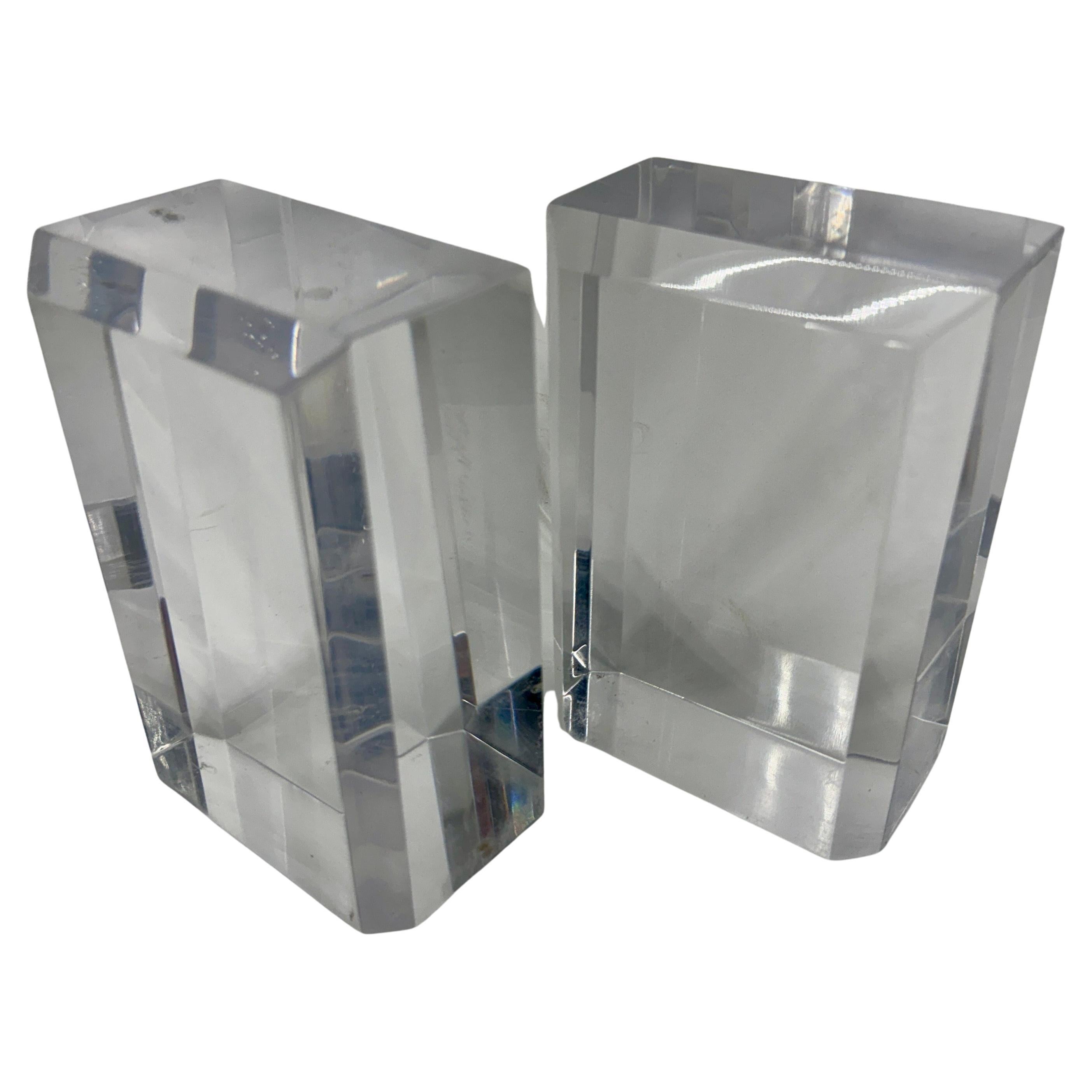 Lucite Mid-Century Bookend Set, 1960's 

Vintage Mid-Century Modern, heavy Lucite bookends with beautiful beveled edges. These bookends almost glow when the light hits them. Polished and substantial, this pair is an excellent addition to any modern
