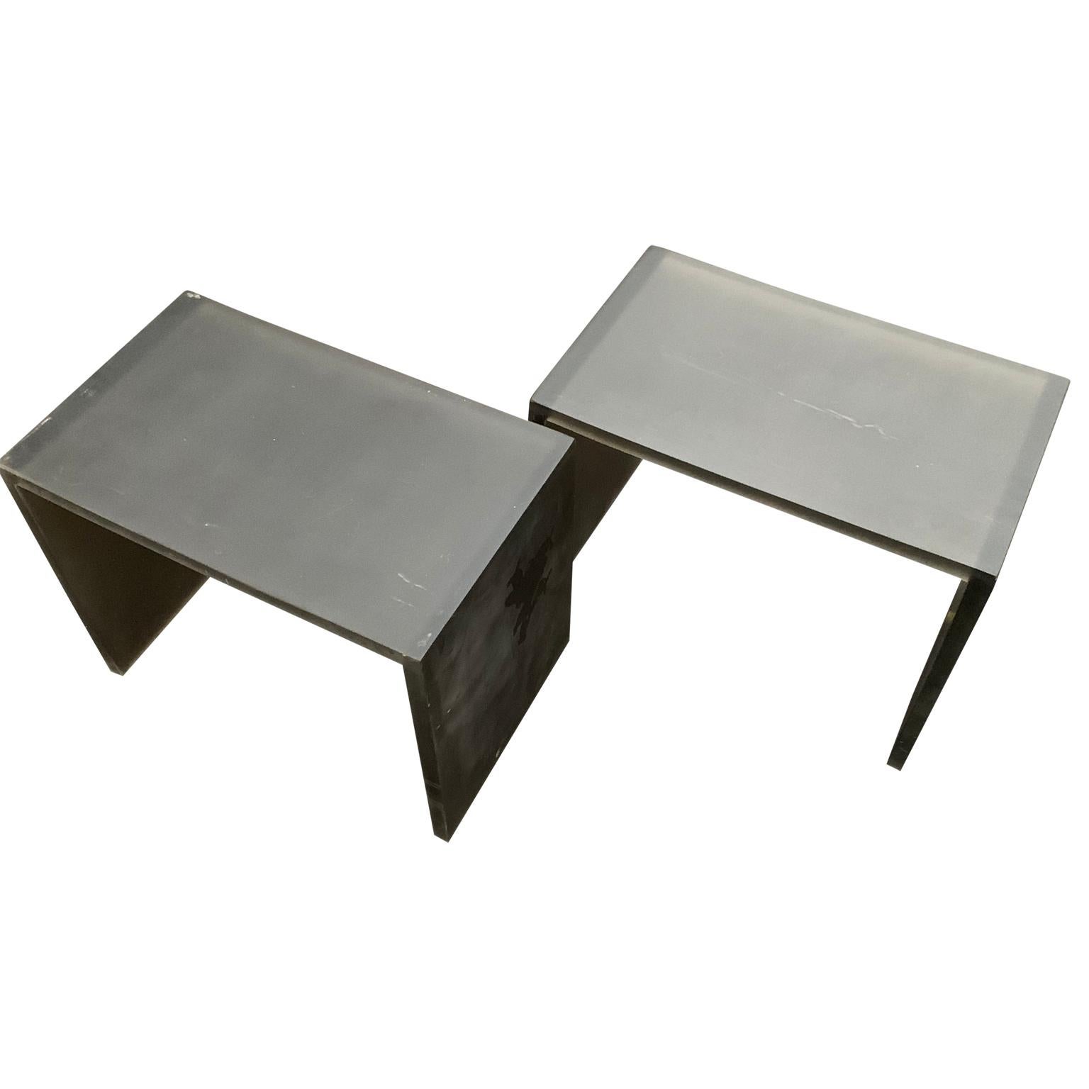 Pair of Mid-Century Modern black frosted lucite or resin side tables. These can also be used for benches.