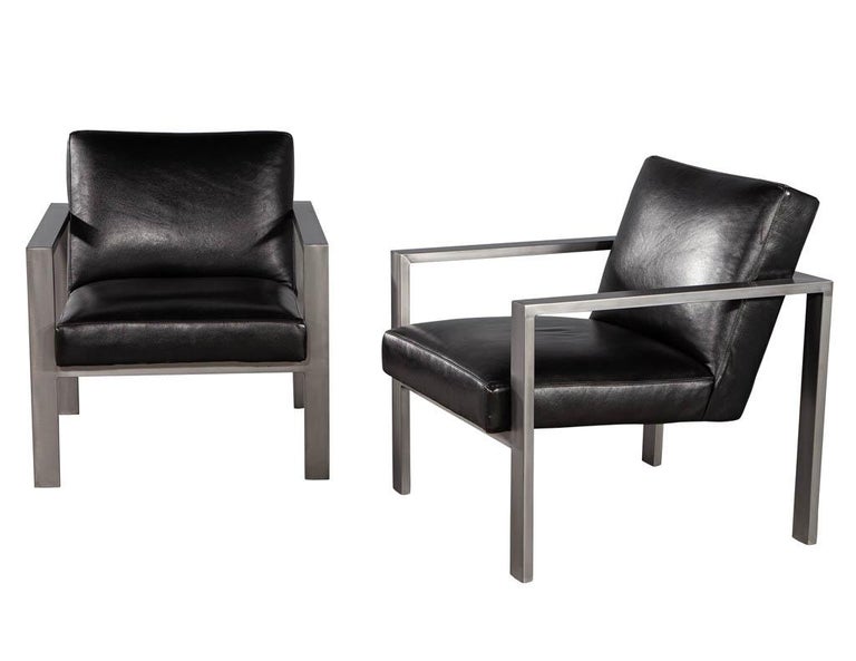 Stainless Steel Pair of Mid-Century Modern Black Leather Metal Lounge Chairs with Ottomans For Sale