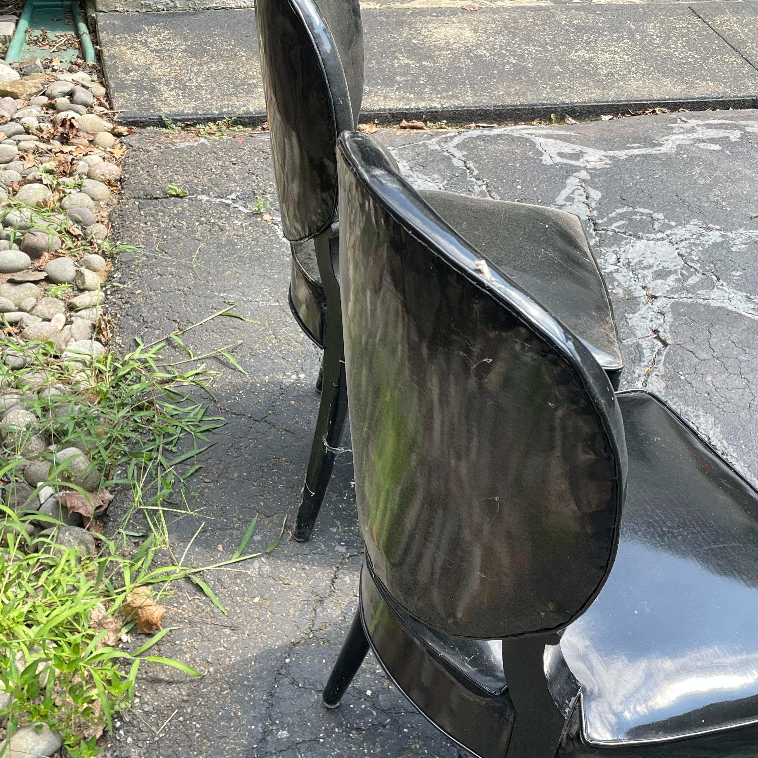 Very cool pair of Mid Century Modern black patent leather side chairs with ornate turned wood legs, James Mont style.  