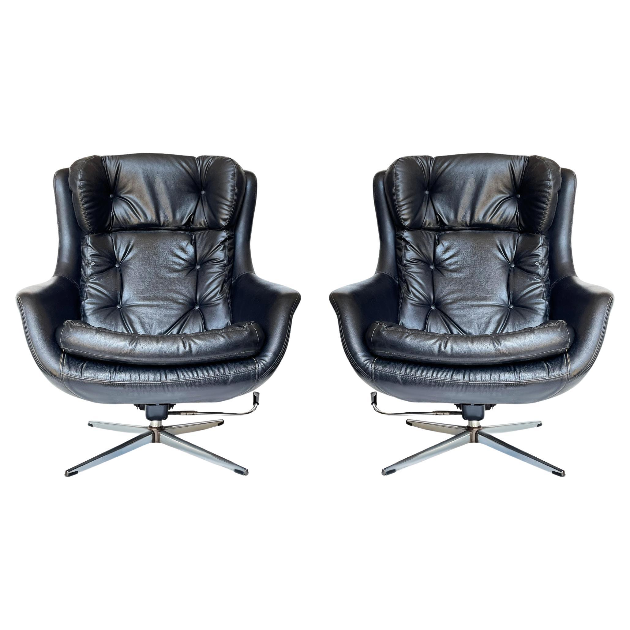 Pair of Mid Century Modern Black Swivel Lounge Chairs by Overman Sweden 
