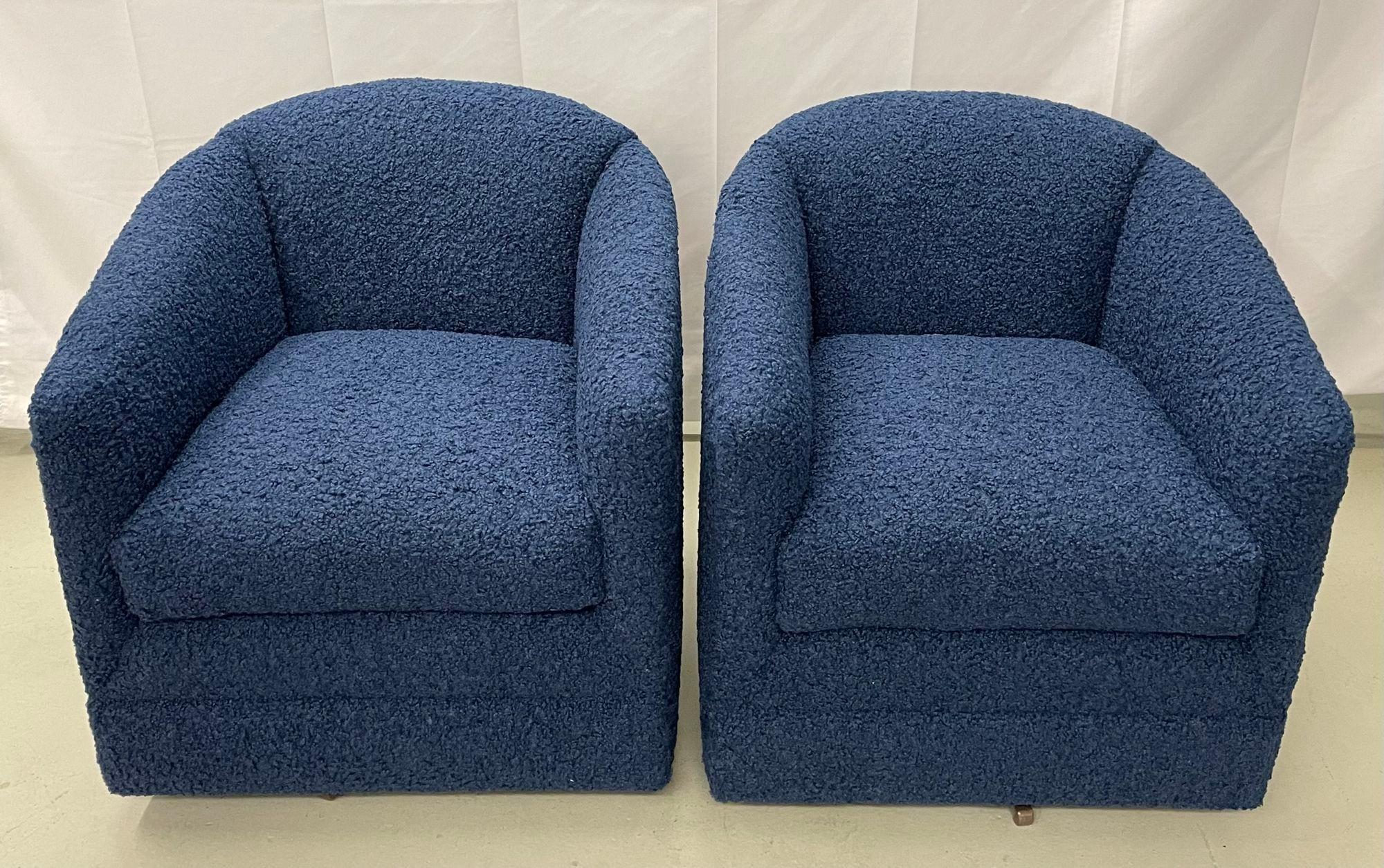 Pair of Mid-Century Modern blue boucle swivel / barrel chairs, Edward Ferrell.
 
Pair of newly re-upholstered Edward Ferrell swivel or barrel back chairs in a cozy blue boucle fabric. 
 
Seat height: 20 inches
 
IZLS