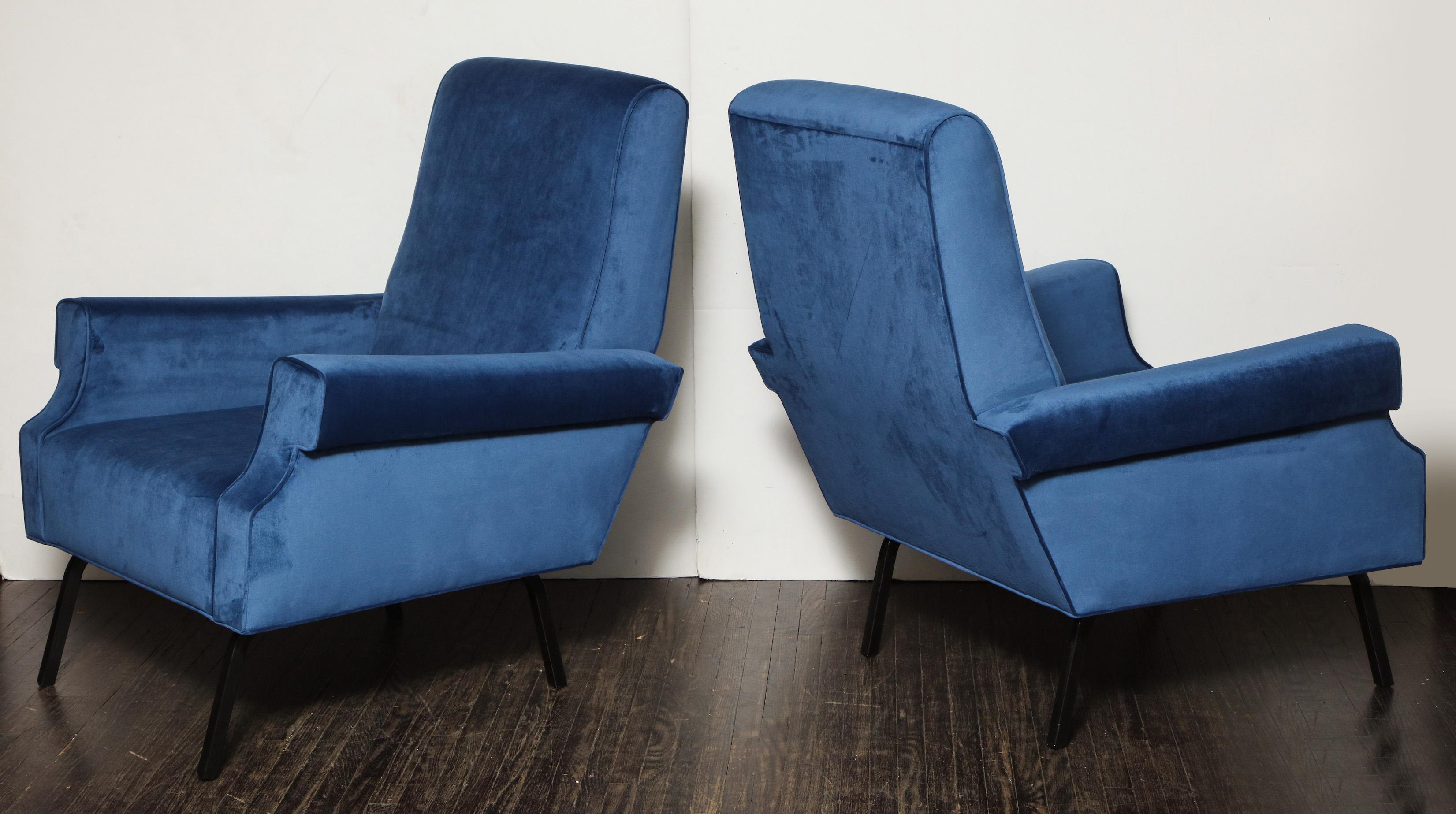 Pair of Mid-Century Modern blue velvet chairs with black iron legs. It was recently reupholstered in 2019.