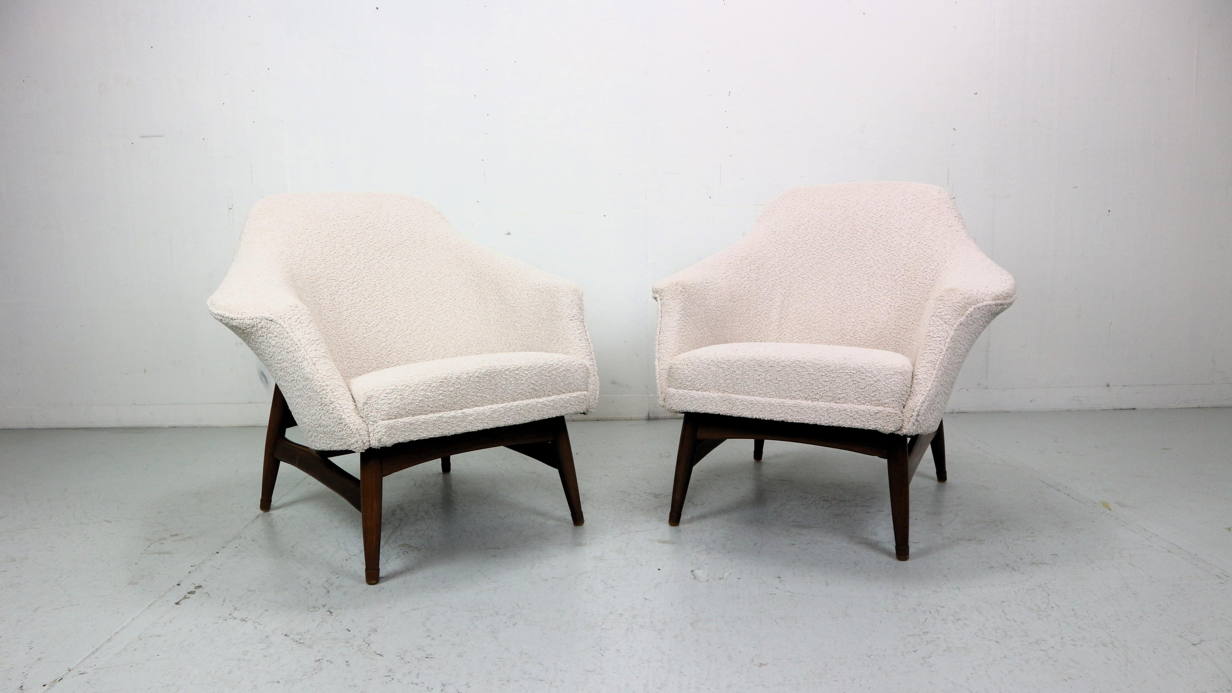 Beautiful armchair newly upholstered in off-white bouclé fabric, designed by Julia Gaubek, a Polish architect, designer of Industrial Design and interior architecture, professor at the Academy of Fine Arts in Gdansk.

The armchairs were made in the