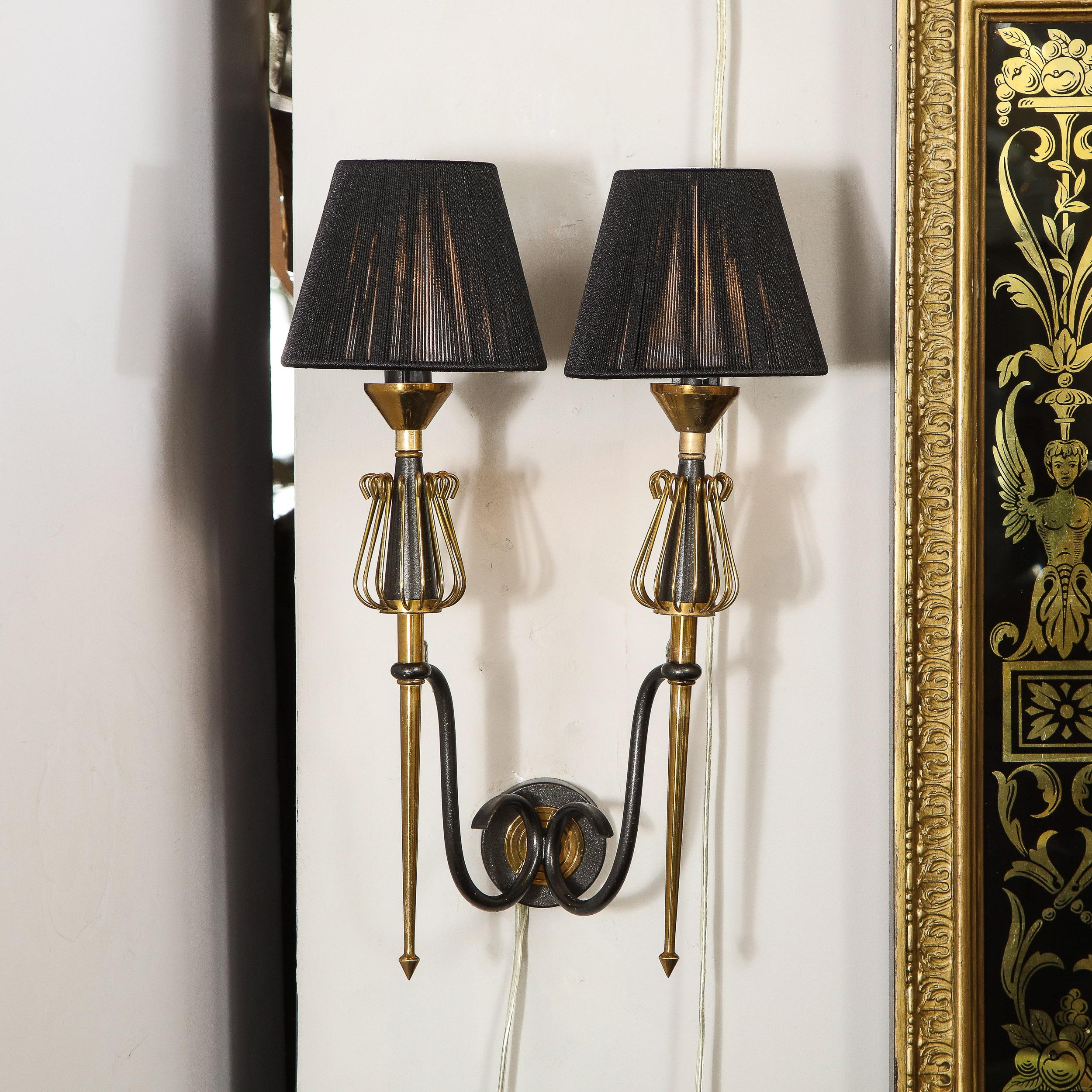 mid-century curvilinear black and brass sconce