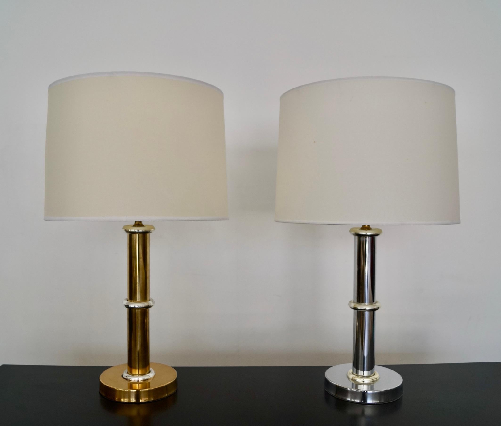 Vintage Mid-century Modern table lamps for sale. From the 1950’s, and in complimenting chrome and brass. One lamp is chrome with brass rings and the brass lamp has chrome rings on the stem. They’re both in working order, and in great condition. They