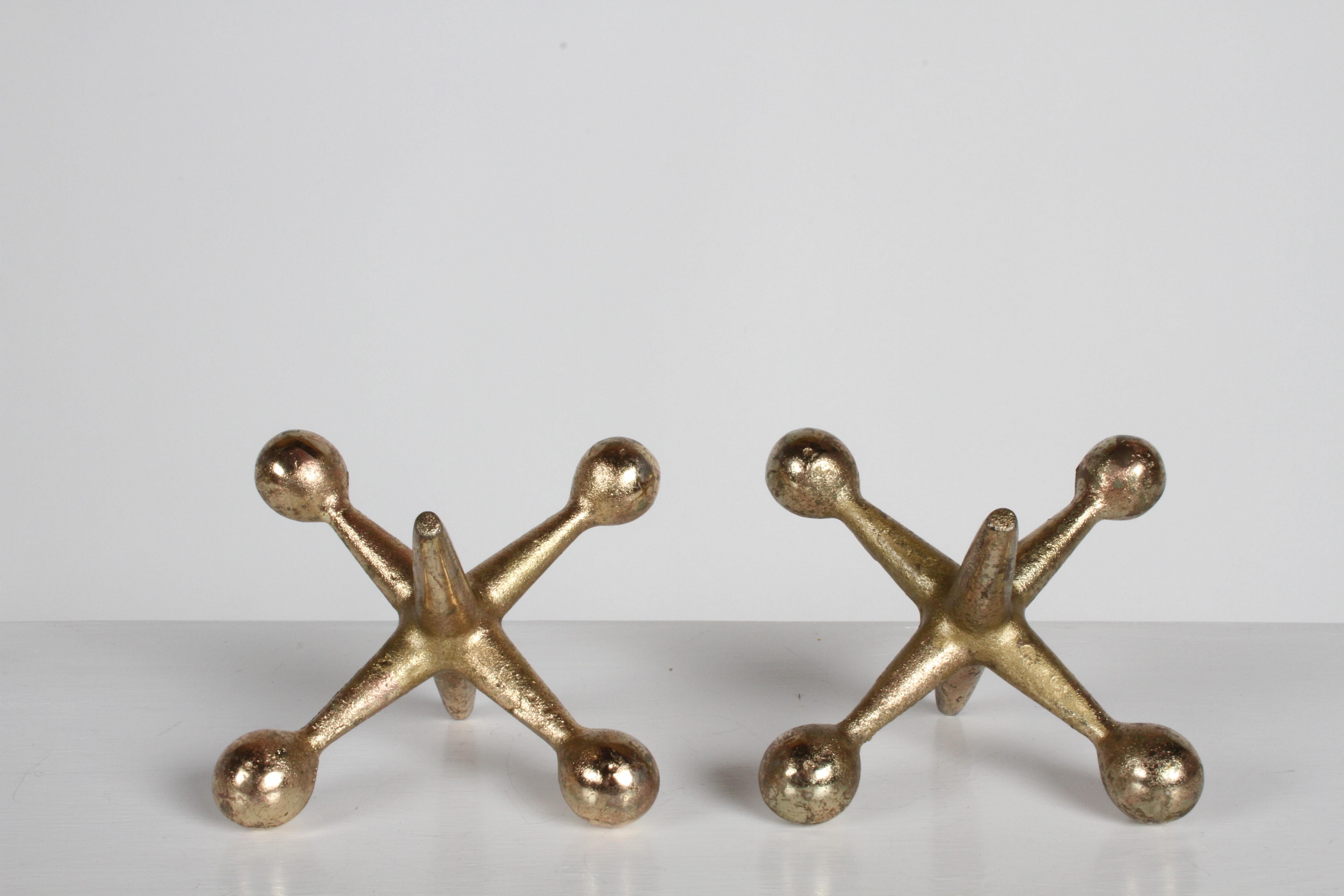 Vintage set of Bill Curry style brass plated iron jacks bookends or decorative objects. Often attributed to George Nelson, these are all original. Light wear to plating, otherwise very nice.