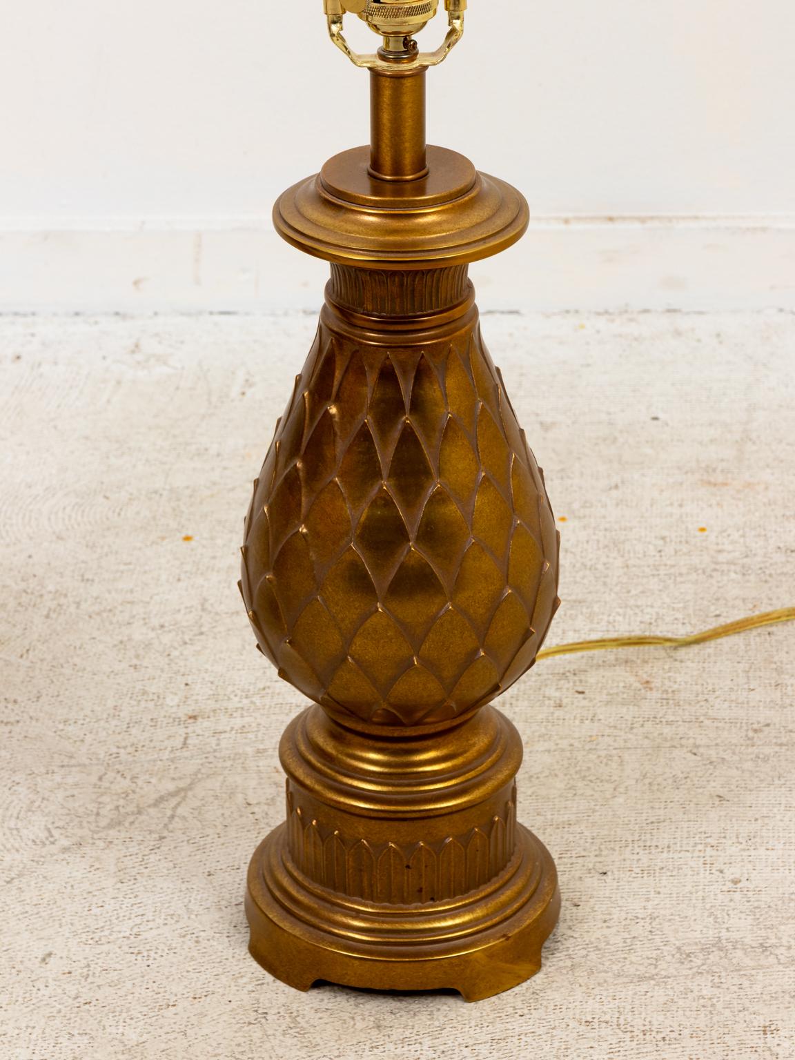 Circa 1980s pair of Mid-Century Modern style brass table lamps in the shape of stylized pineapple designs. Shades not included. Please note of wear consistent with age. Made in the United States.