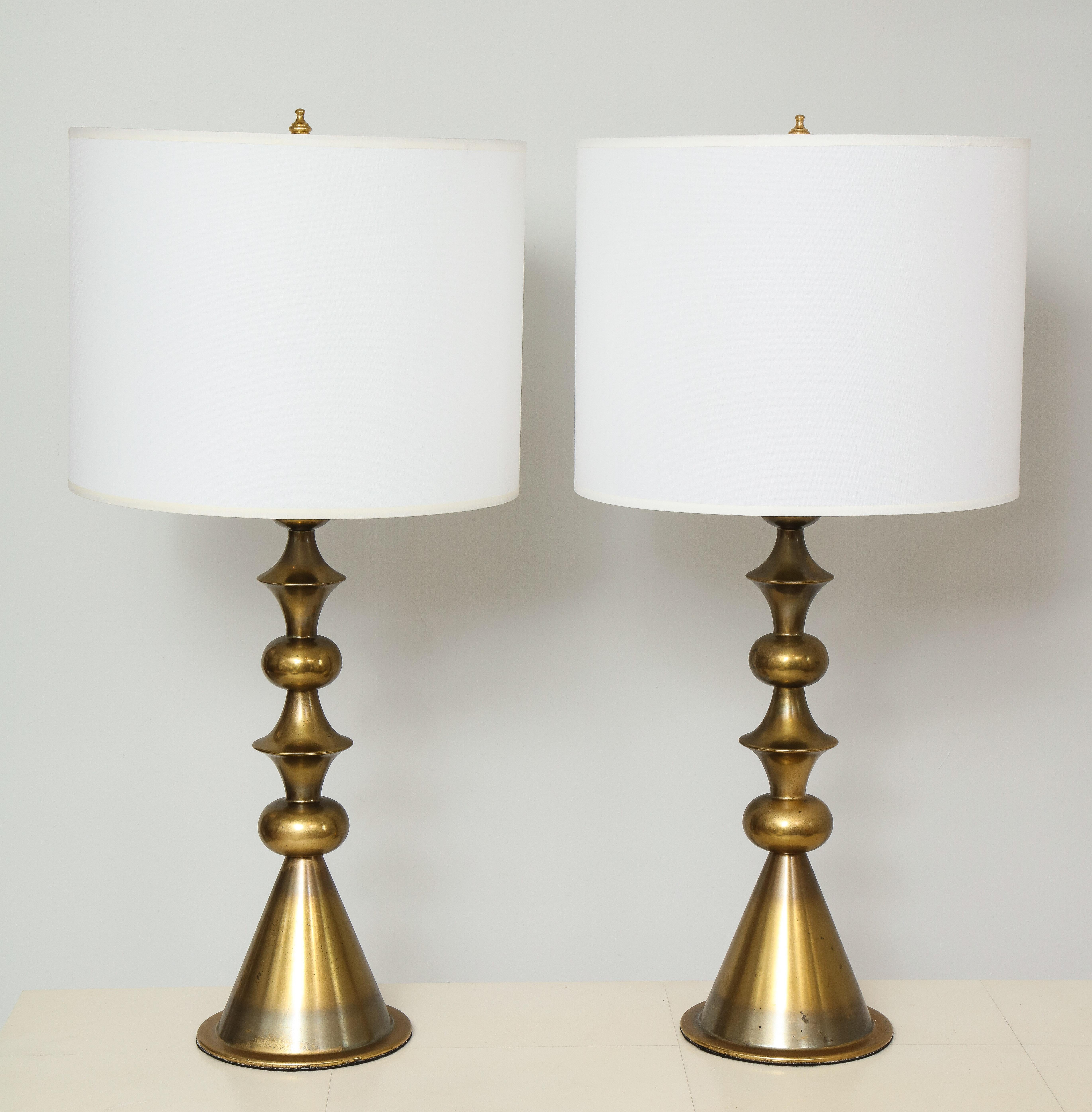 Pair of Mid-Century Modern brass table lamps in the manner of Tommi Parzinger.