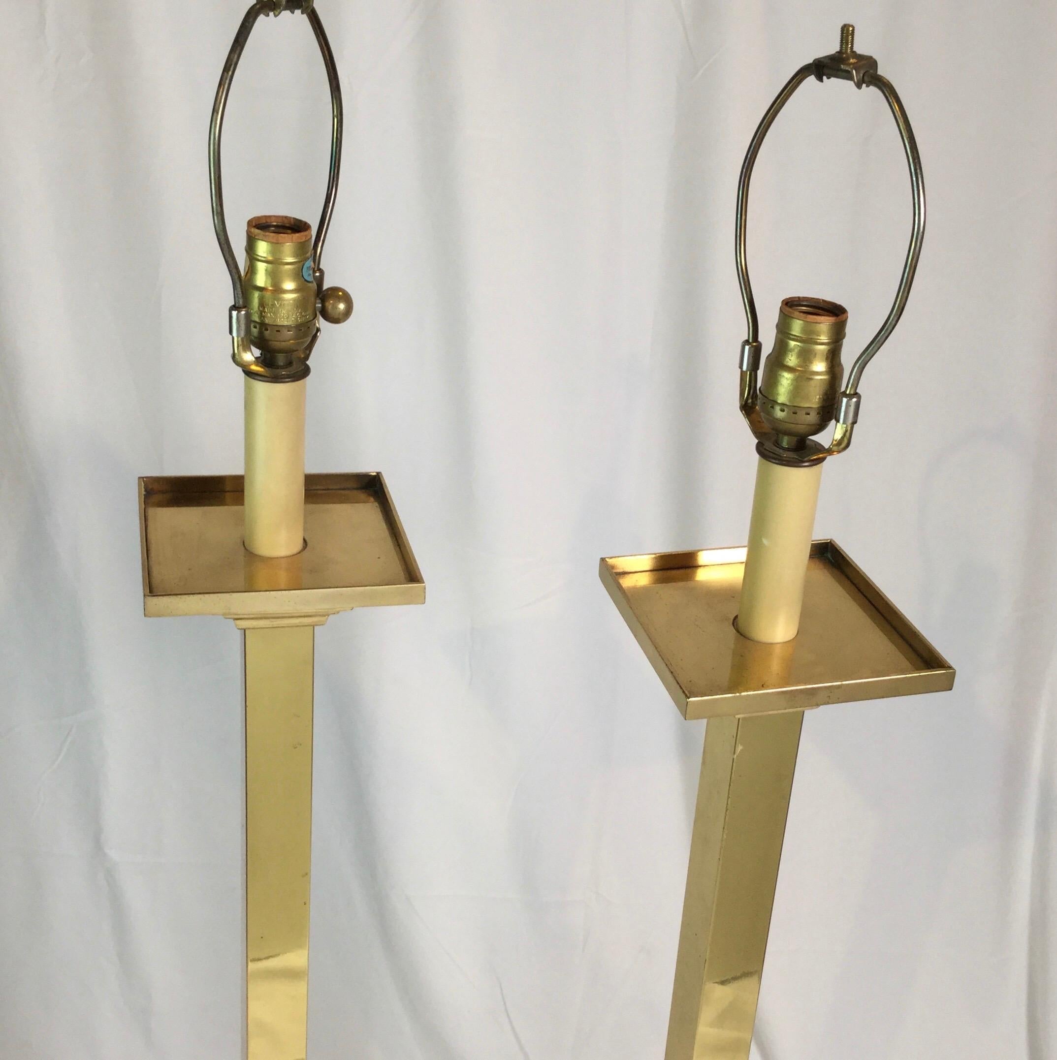 An oversized pair of Classic modern tall lamps in original condition. Brass nicely aged and recently re wired. 46 .5