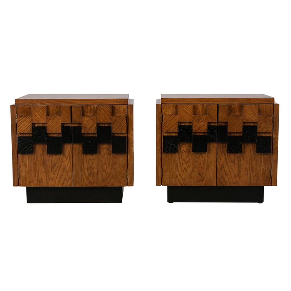 This pair of fully restored Brutalist-style nightstands has been stained dark walnut and black color combination with a lacquered finish. The two sleek doors feature a unique Brutalist front, with unusually carved pulls, and when opened reveal an