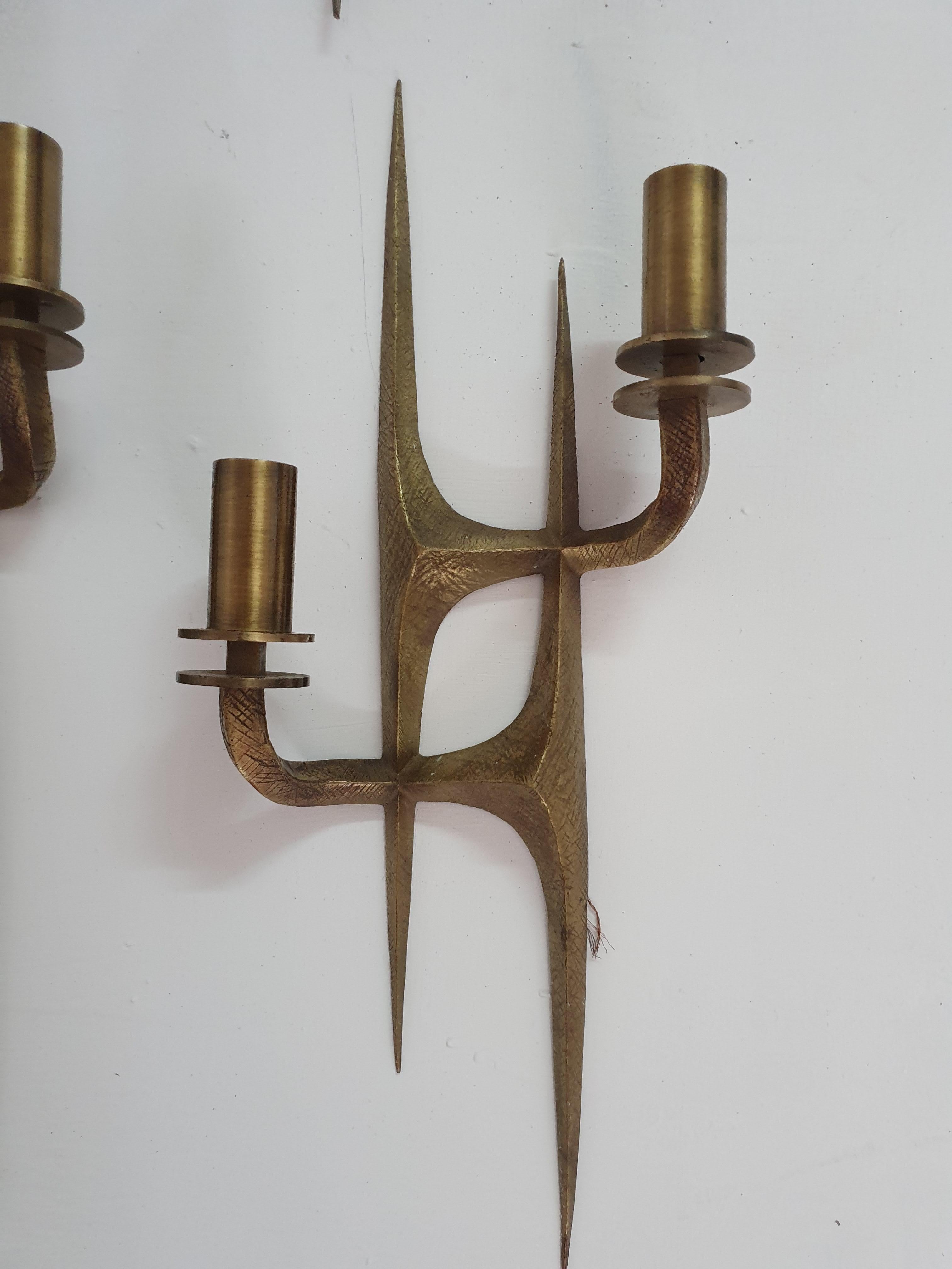 Pair of 2-light brass sconces in the manner of Felix Agostini.
There are 2 pairs available, part of a set of 6 together with a pair of 4-light sconces listed in our gallery as well.
They all came from the same Villa in Italy.
They are done in a