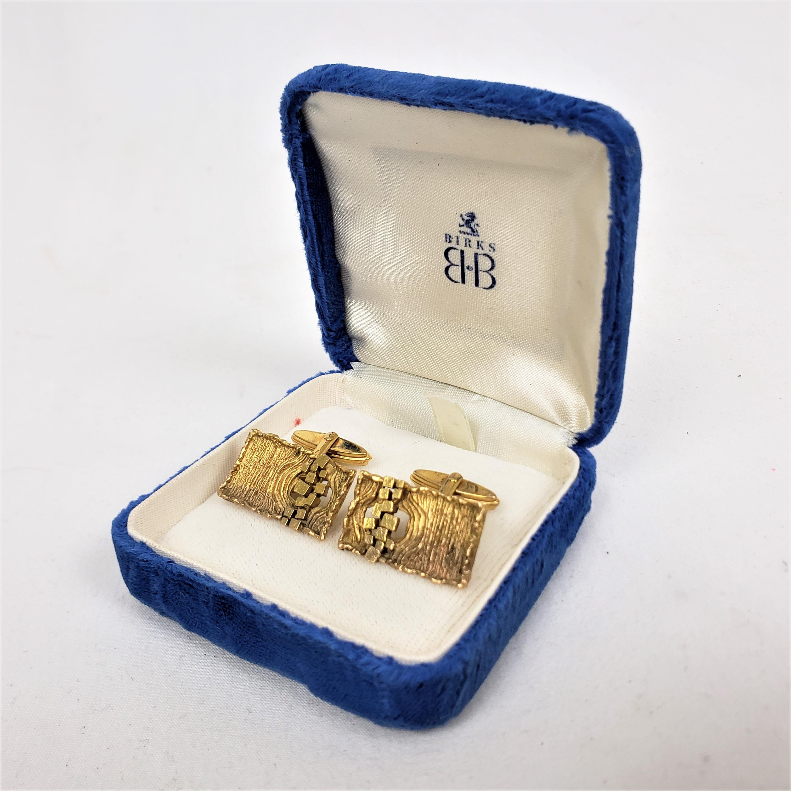 This pair of cufflinks are initialed by an unknown maker, but originated from West Germany and date to approximately 1960 and done in the Brutalist Mid-Century Modern style. The cufflinks are composed of 1`8 karat yellow gold with a panelled front