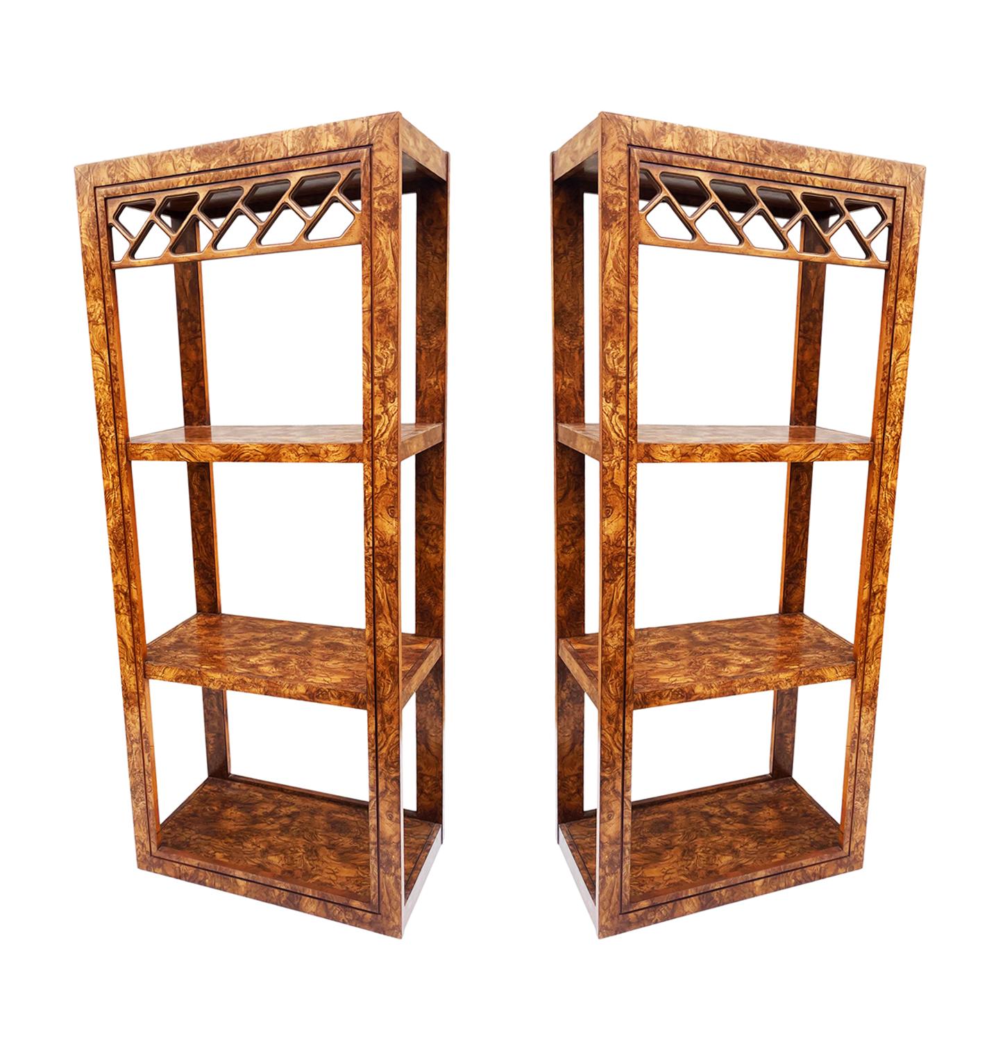 A stunning transitional pair of matching shelving units from the 1970's. They feature burl wood with a decorative lattice work. Price includes the pair.
